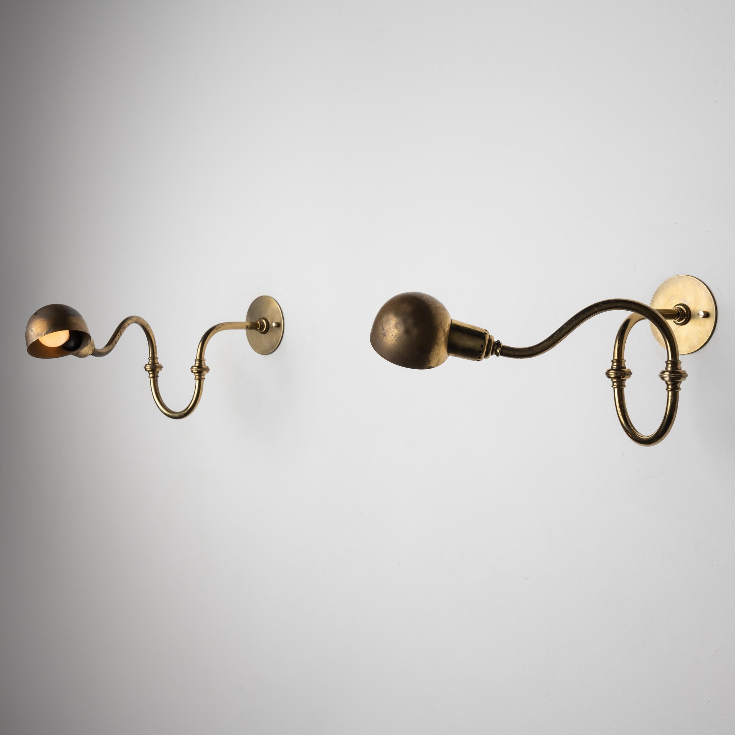 Two LP15 Tromba Sconces by Luigi Caccia Dominioni for Azucena. Designed in Italy, circa 1950s. Arms and shade of light articulate to various positions. Wired for US. We recommend one E14 base 75w maximum bulb per light. Priced and sold as individual