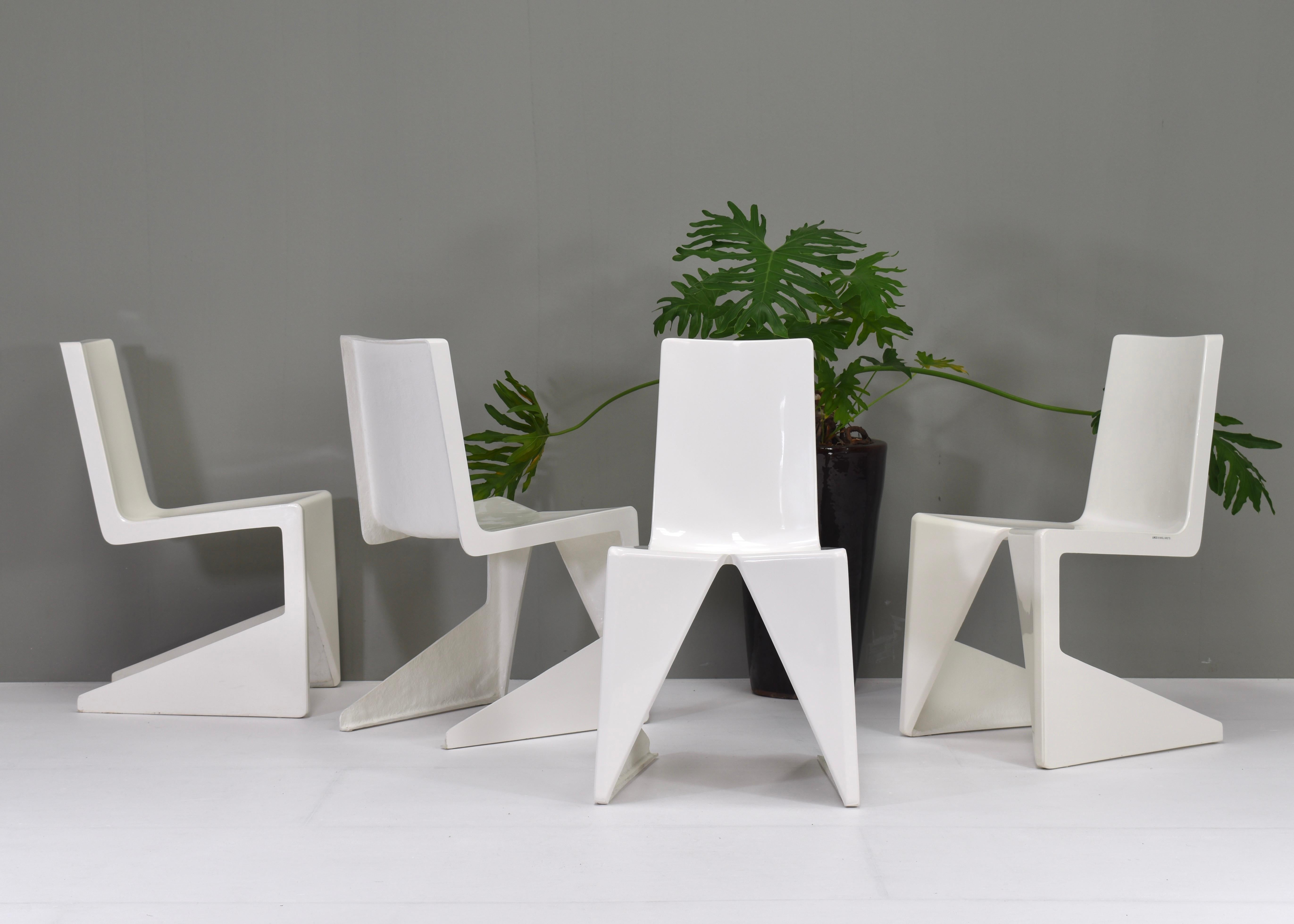 Sculptural modernistic dining chairs designed by architect Wiel Arets and manufactured by Lensvelt. The chairs were designed for the Leidsche Rijn College (LRC) in Utrecht, The Netherlands. The chairs are made of fiberglass and all are labeled. Only