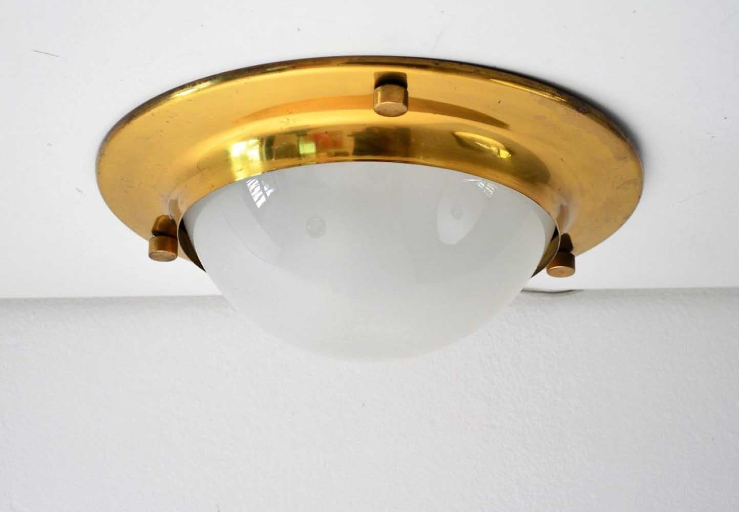 Luigi Caccia Dominioni for Azucena. 
ceiling or wall flush mount light.
Model LSp6.

Frosted glass shade.
Brass frame.

Original 1960s.
three lamps available.