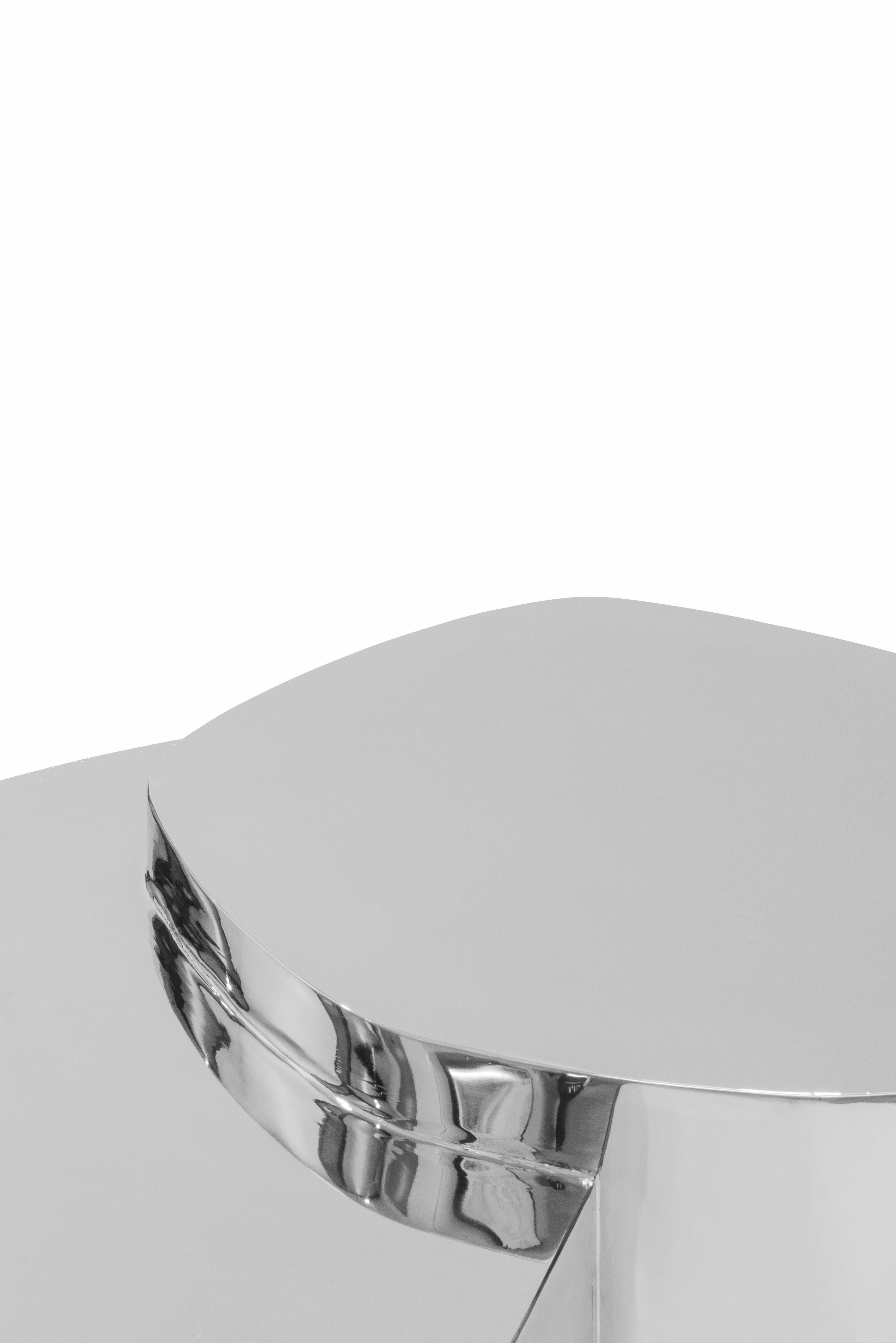 LT01 coffee table in polished steel is presented by Sabourin Costes, France, 2020

LT-01 is a mirror polished low table which manipulates the reflexions and distortions off its surroundings. Its shiny stainless steel shell decompose and