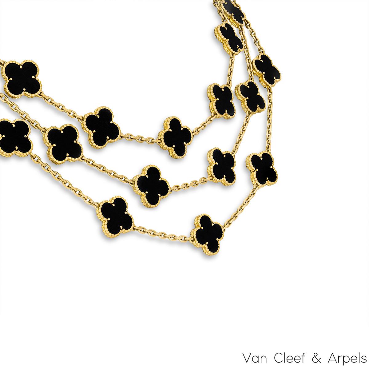 An iconic 18k yellow gold necklace by Van Cleef & Arpels from the Vintage Alhambra collection. The necklace features 29 iconic 4 leaf clover motifs, each set with a beaded edge and a onyx inlay, set throughout the length of the chain on 3 different