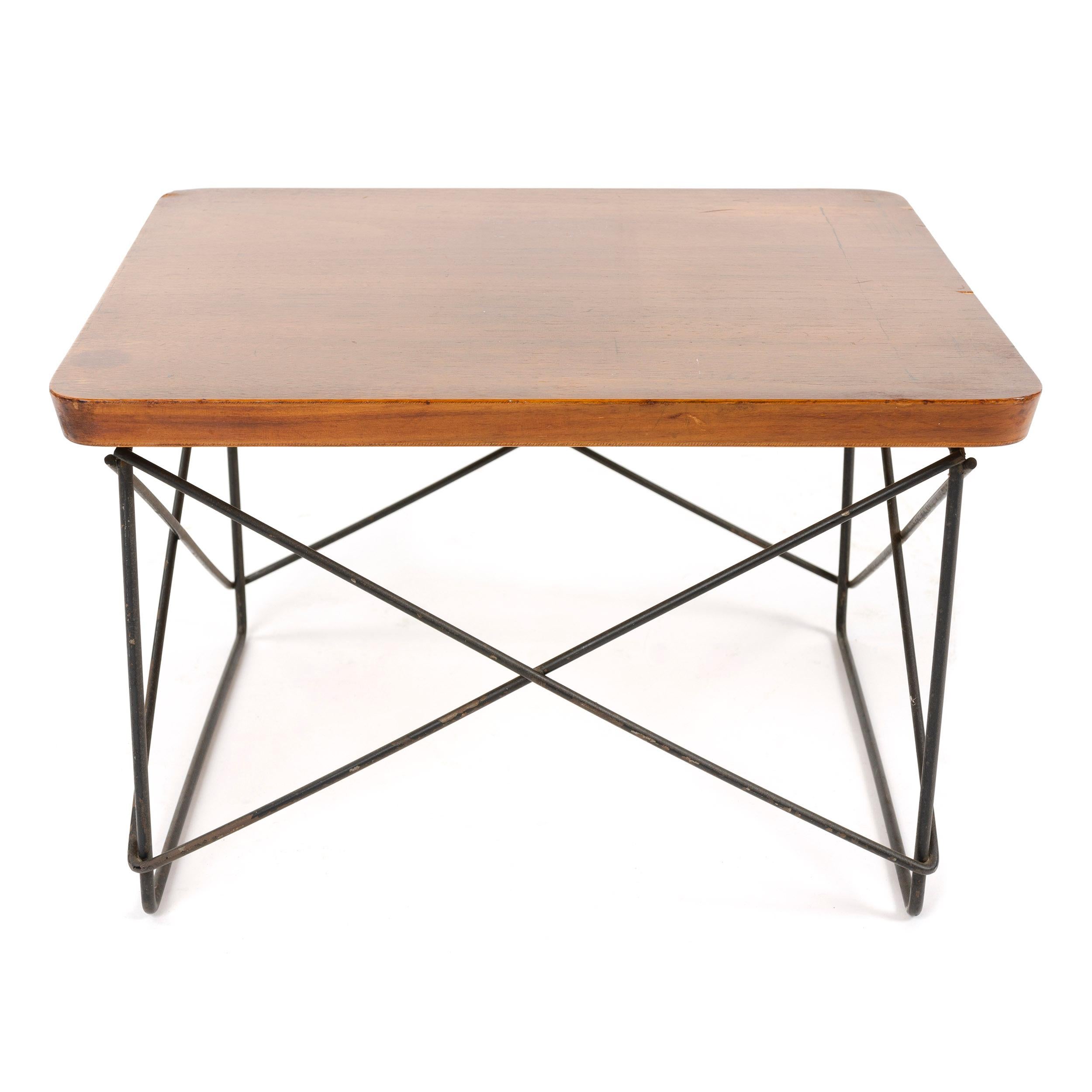A 'LTR' (Low Table Rod) occasional table designed by Charles and Ray Eames. Laminated plywood top on a metal strut base. Made by Herman Miller in the USA, circa 1950s.