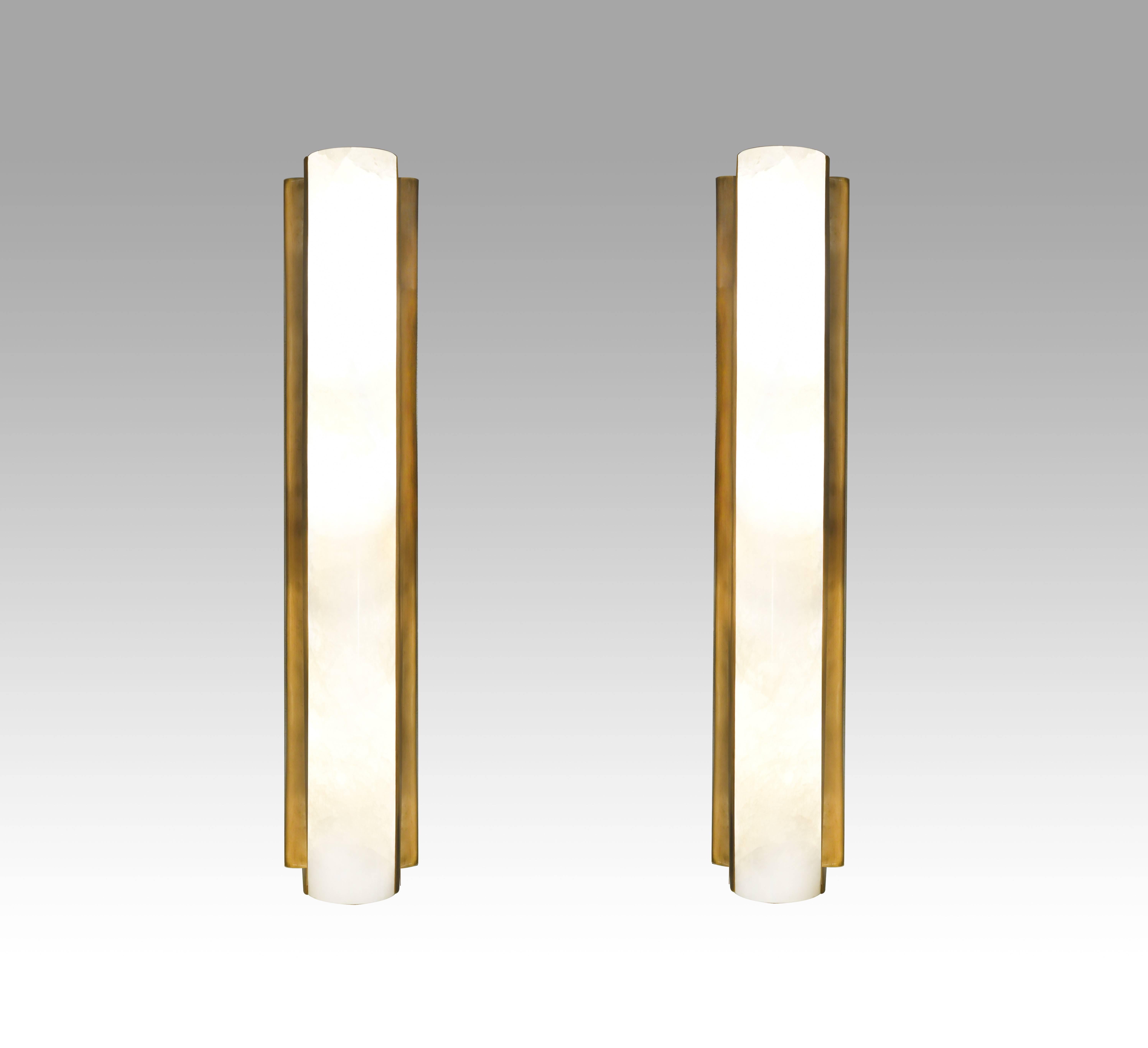  pair of elegant form long tube rock crystal sconces by Phoenix gallery NYC.antique brass finish.180w each sconce 
Custom size available.
