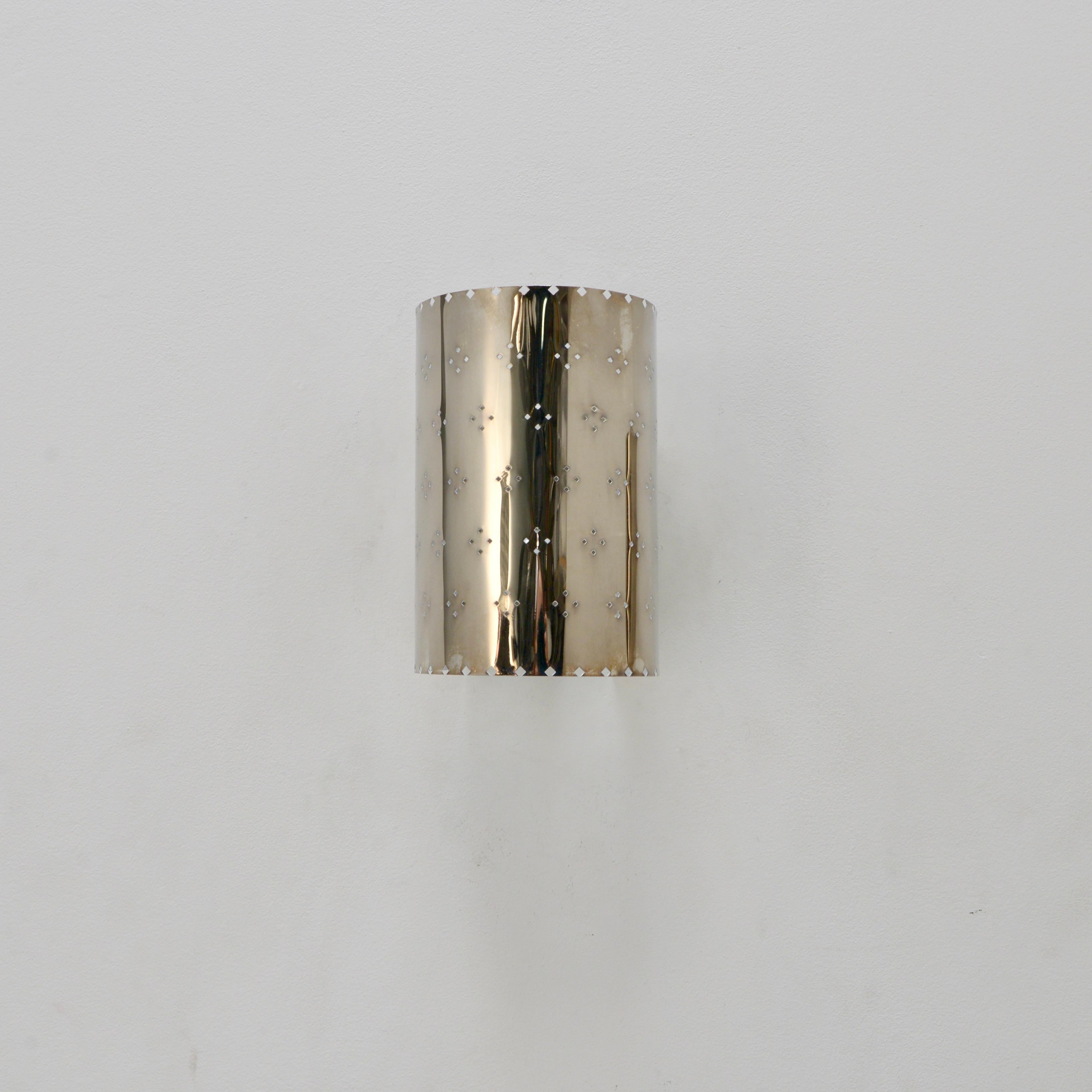 Handsome LU Louis sconce AS. An all brass wall sconce in an aged silver finish with patterned perforations by Lumfardo Luminaires. Made contemporary in the US. Multiples available for order. Can be wired for use anywhere in the world. (2) E26 medium