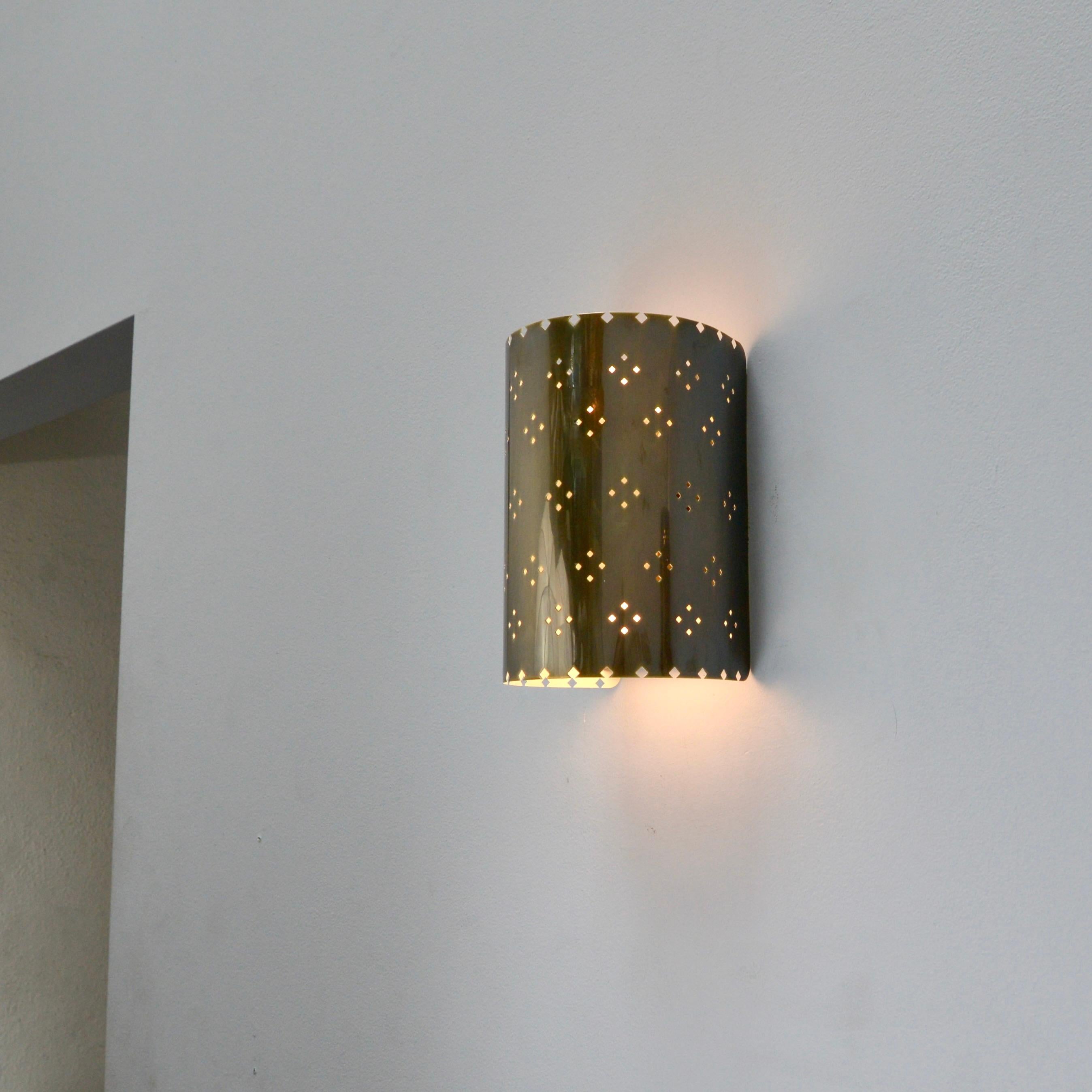 The handsome LU Louis SM Sconce is a smaller version of our LU Louis Sconce, an all brass wall sconce in lightly patinated brass with patterned perforations by Lumfardo Luminaires. Made contemporary in the US. Multiples available for order. Can be