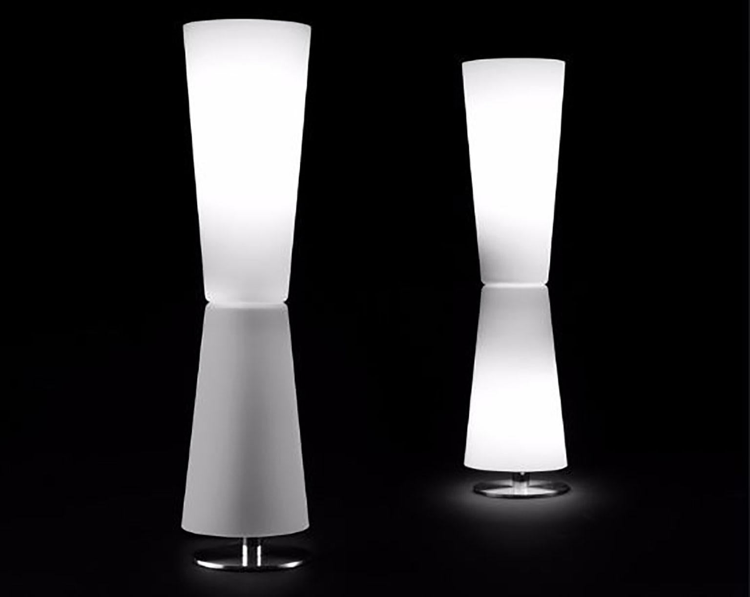 Lu-Lu table lamp designed by Stefano Casciani for Oluce. This lamp provides separately controllable light from both the upper and lower halves of the fixture through a blown Murano glass diffuser with brushed metal for the base. There is a dimmer