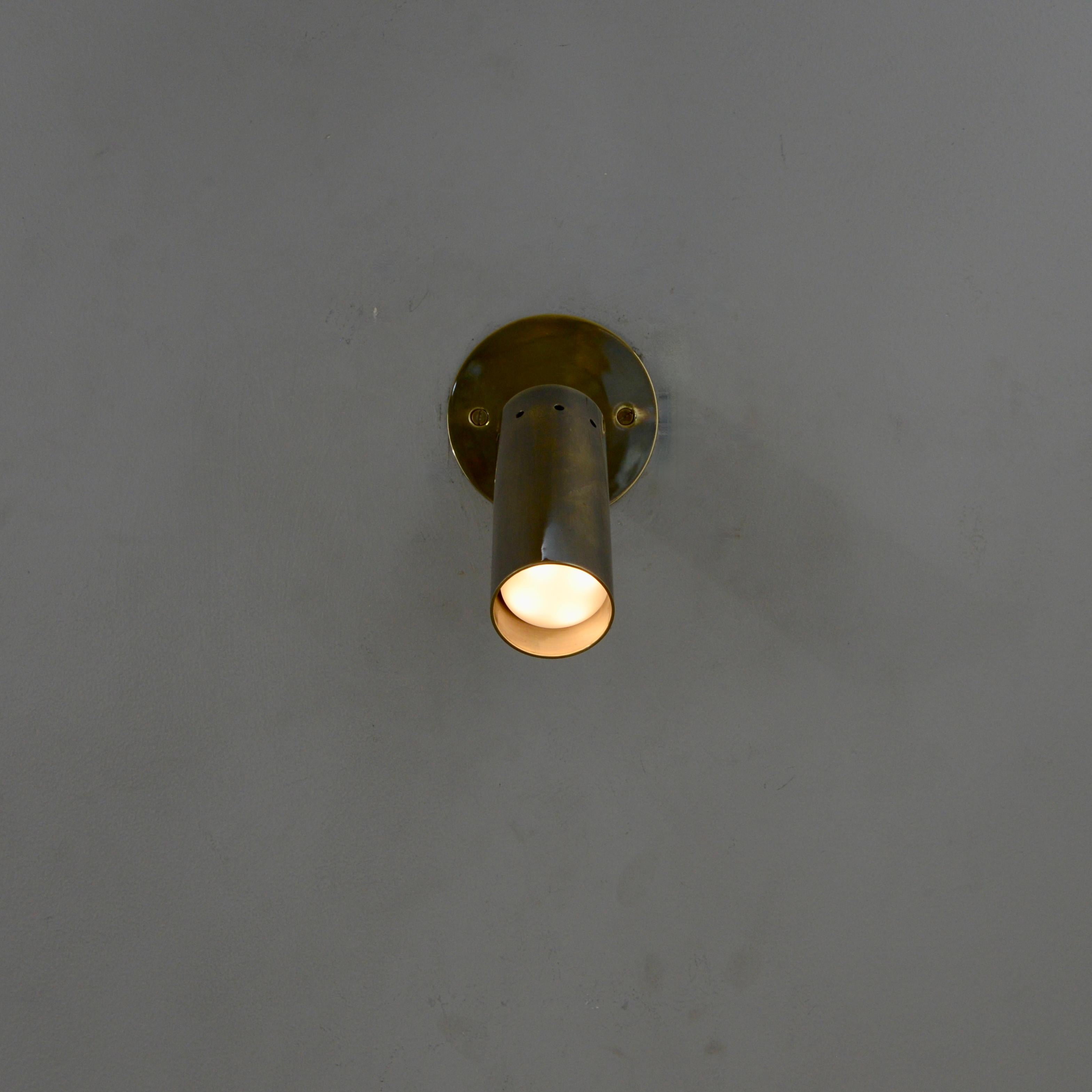 Patinated LU Mono Spot Sconce  For Sale