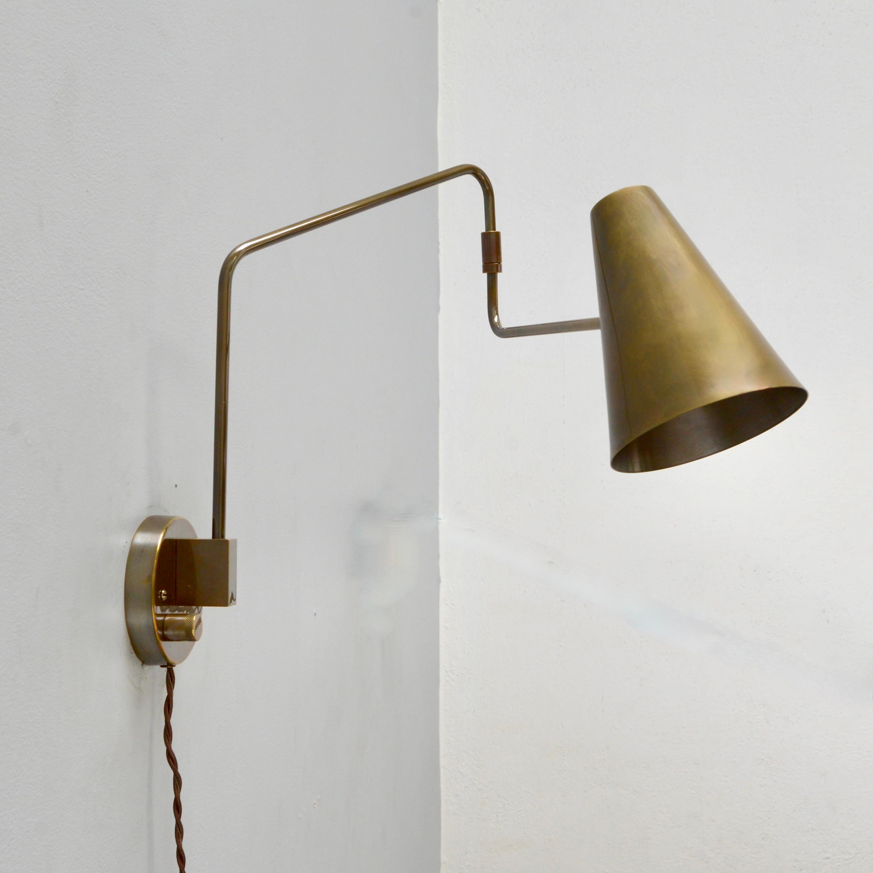 Beautiful plug-in version of our Lumfardo Luminaires brass LU swing sconce in patinated brass. Wired with an E26 medium based socket. Light bulb provided as well as all mounting hardware. Priced individually.

Measurements: 
Height 15”
Depth/length: