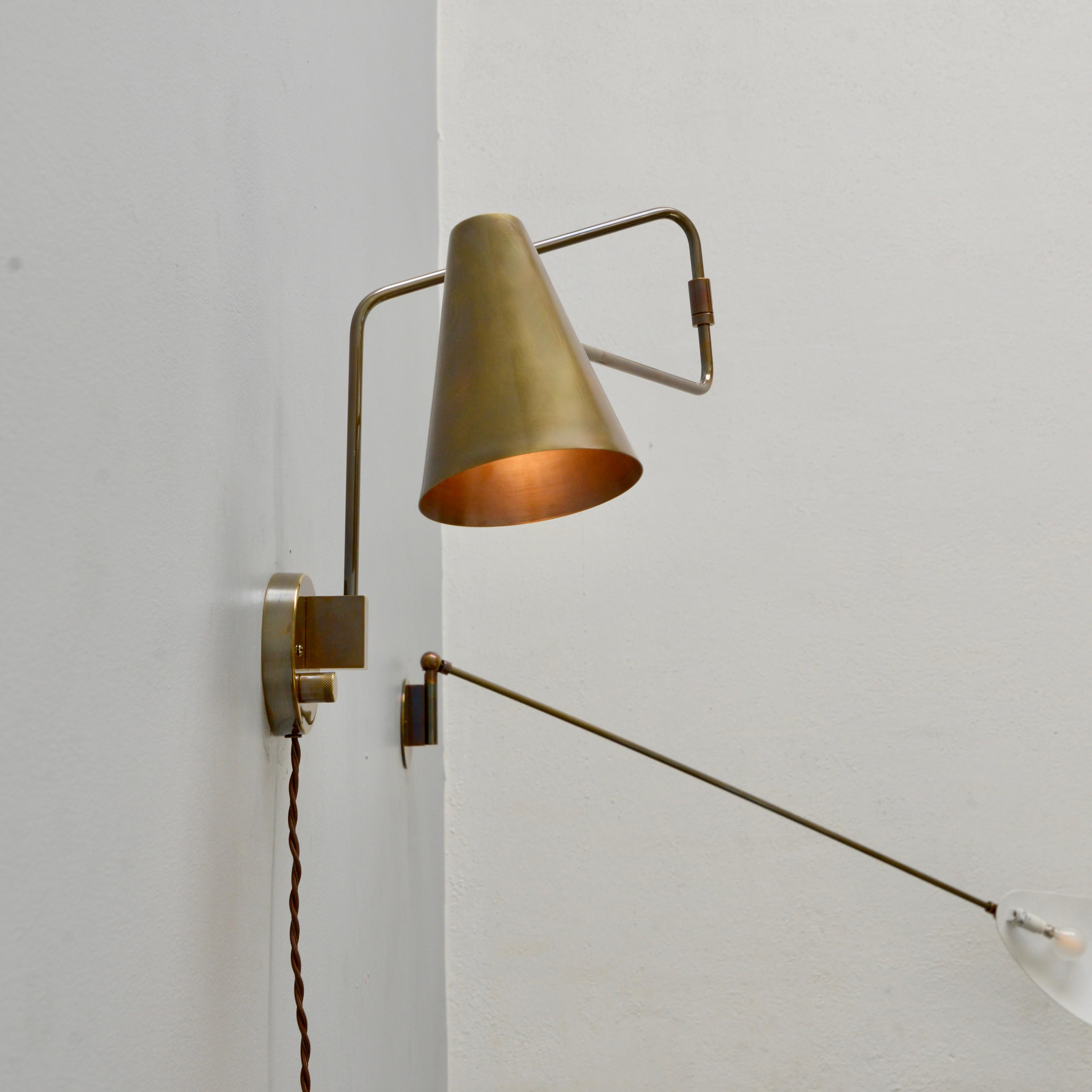 Patinated LU Swing Sconce Plug-In For Sale