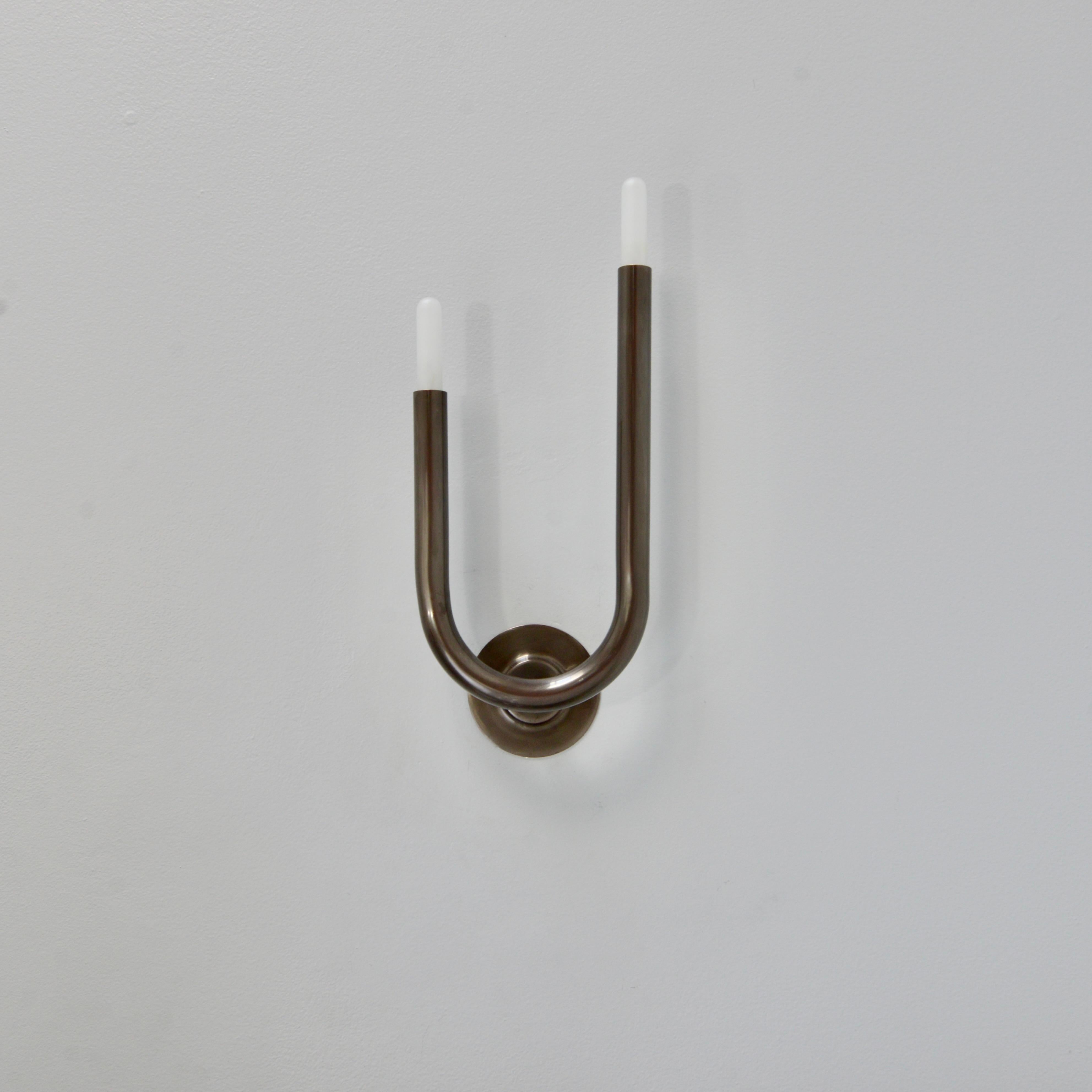 Superb and sleek modern LU Wall sconces pat cop by Lumfardo Luminaires in patinated unlacquered copper. Candelabra based sockets. Lightbulbs included. Priced as a pair. (left and right sconces)

Measurements are with bulbs.

Measurements:
Height 17”