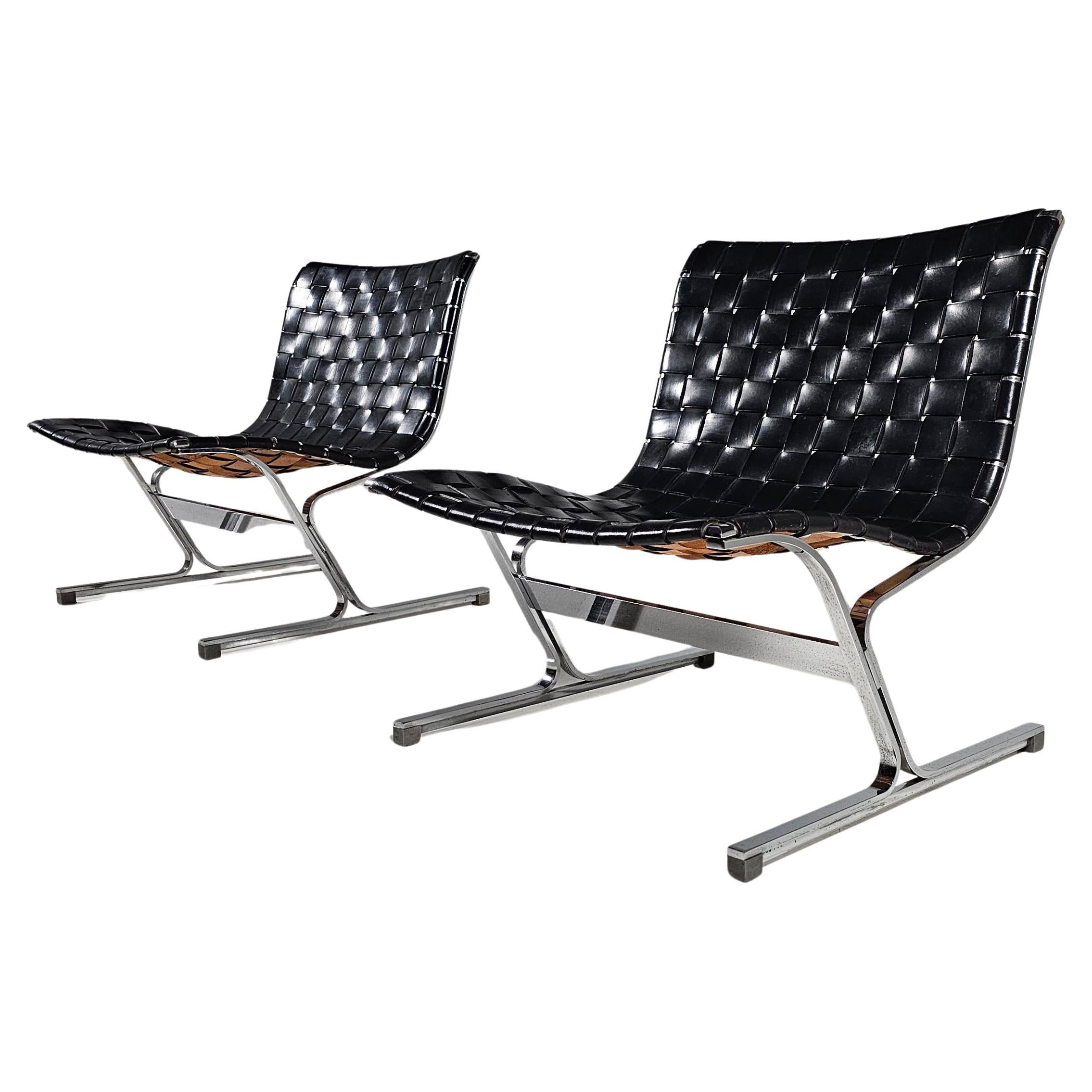 Pair of Luar lounge chairs designed by Ross Littel and manufactured by ICF de Padova, Italy 1965. 

These amazing lounge chairs are made of chrome-plated solid metal frames with amazing black leather with a very rare cognac color back. The straps