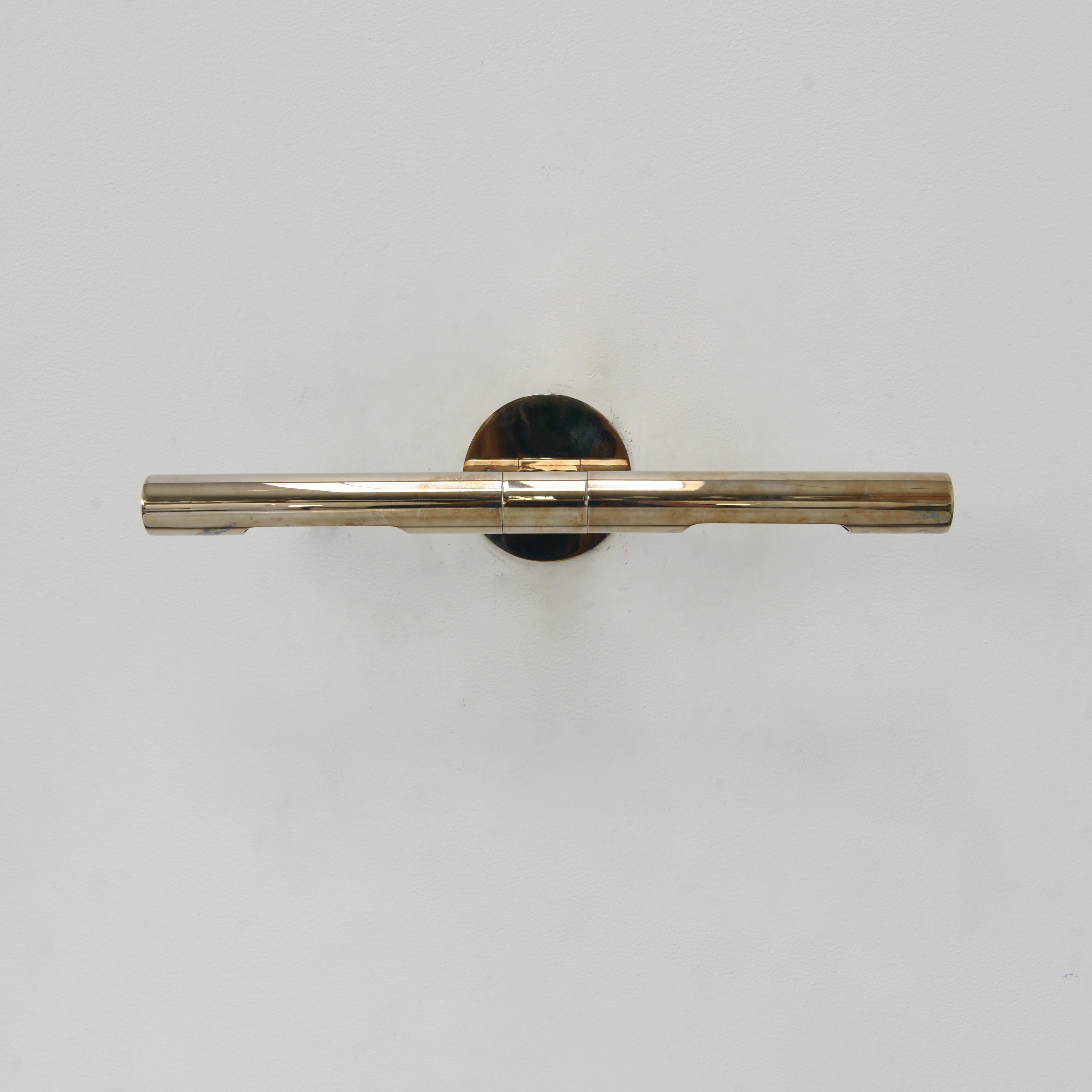 Superbly crafted linear wall sconce designed by Lumfardo Luminaires in an aged silver finish. Sconce is designed to feature artwork and/or objects d’art. Each shade is independent and can be directed individually. Fixture comes with mounting