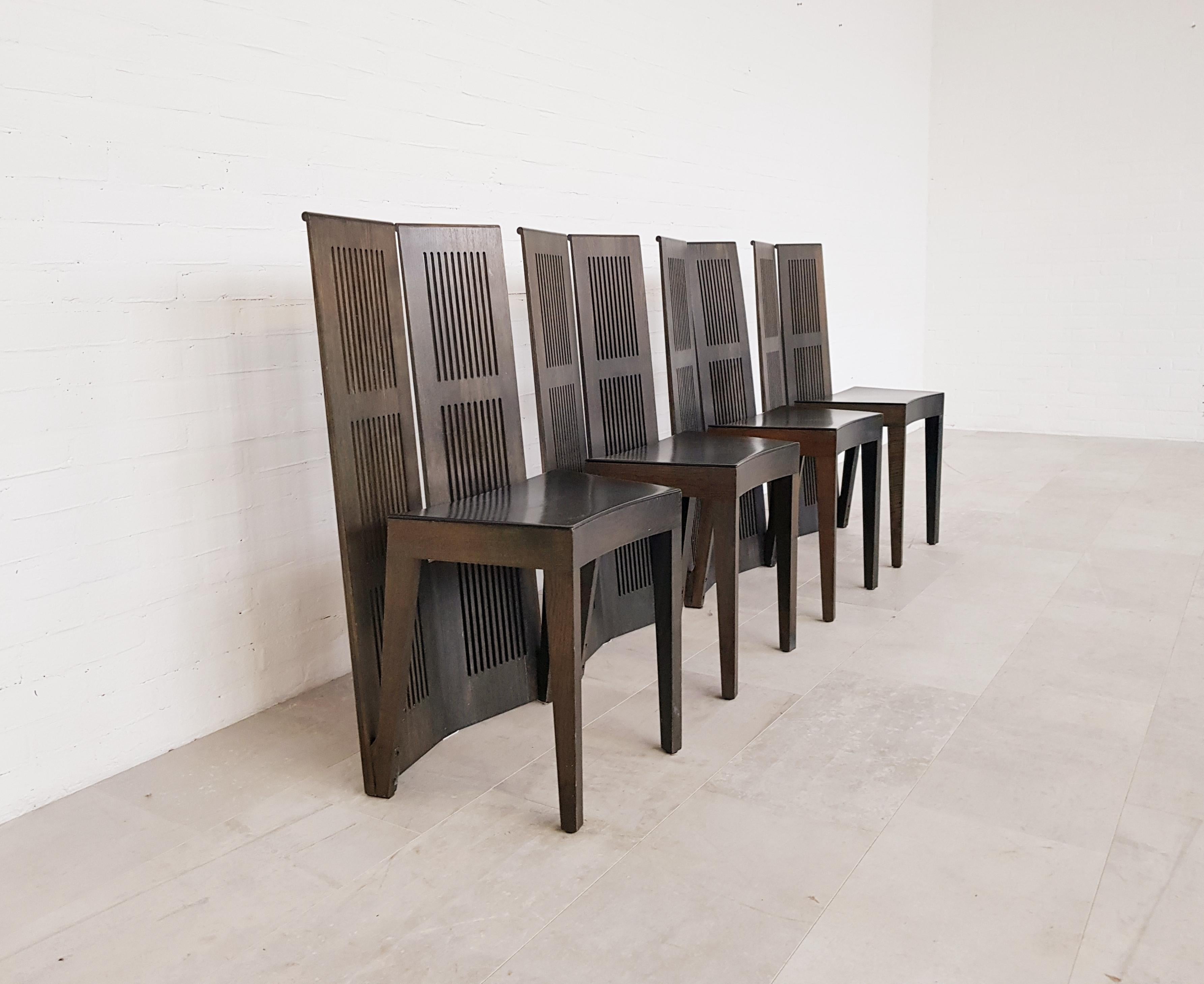 Postmodern Lubekka chairs for Cassina. Designed by Italian architect and designer Andrea Branzi in 1970. The chairs are made in brown wood with black leather seat. The chairs are designed to stand together or separately. The chairs are in excellent