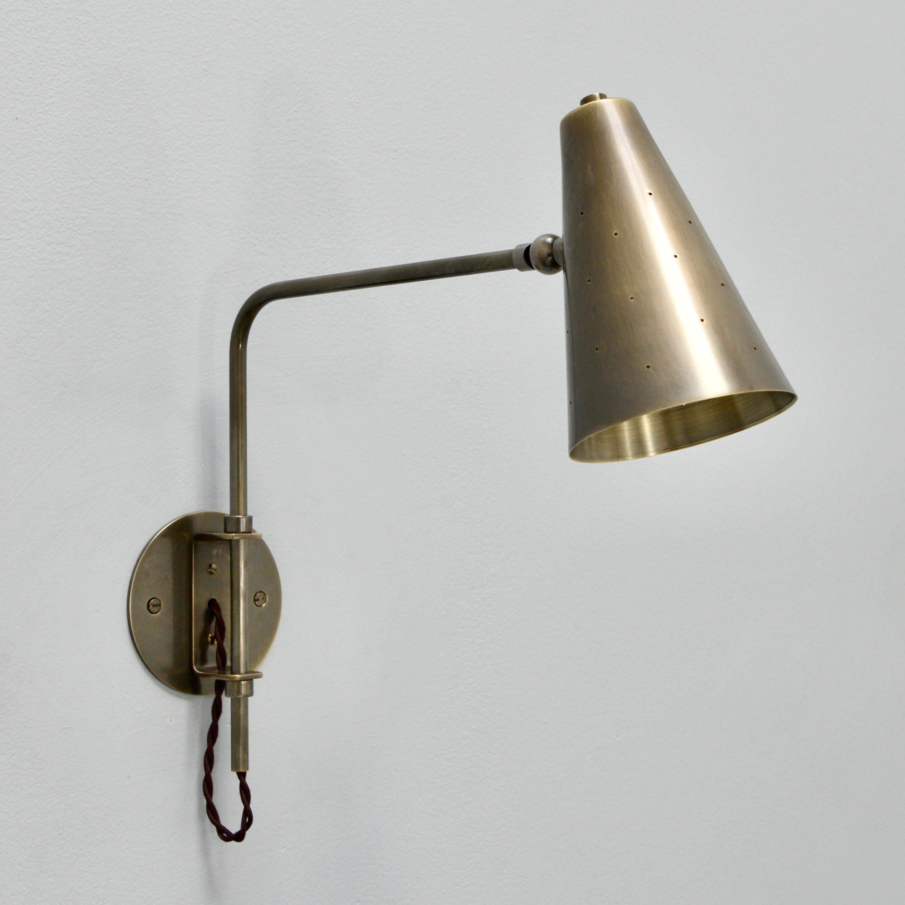 This all patinated brass LUbrary sconce is part of the Lumfardo Luminaires contemporary collection. The sconce can be customized with different dimensions and ordered for hard wired or as plug ins, with a switch either at the cord or at the shade.