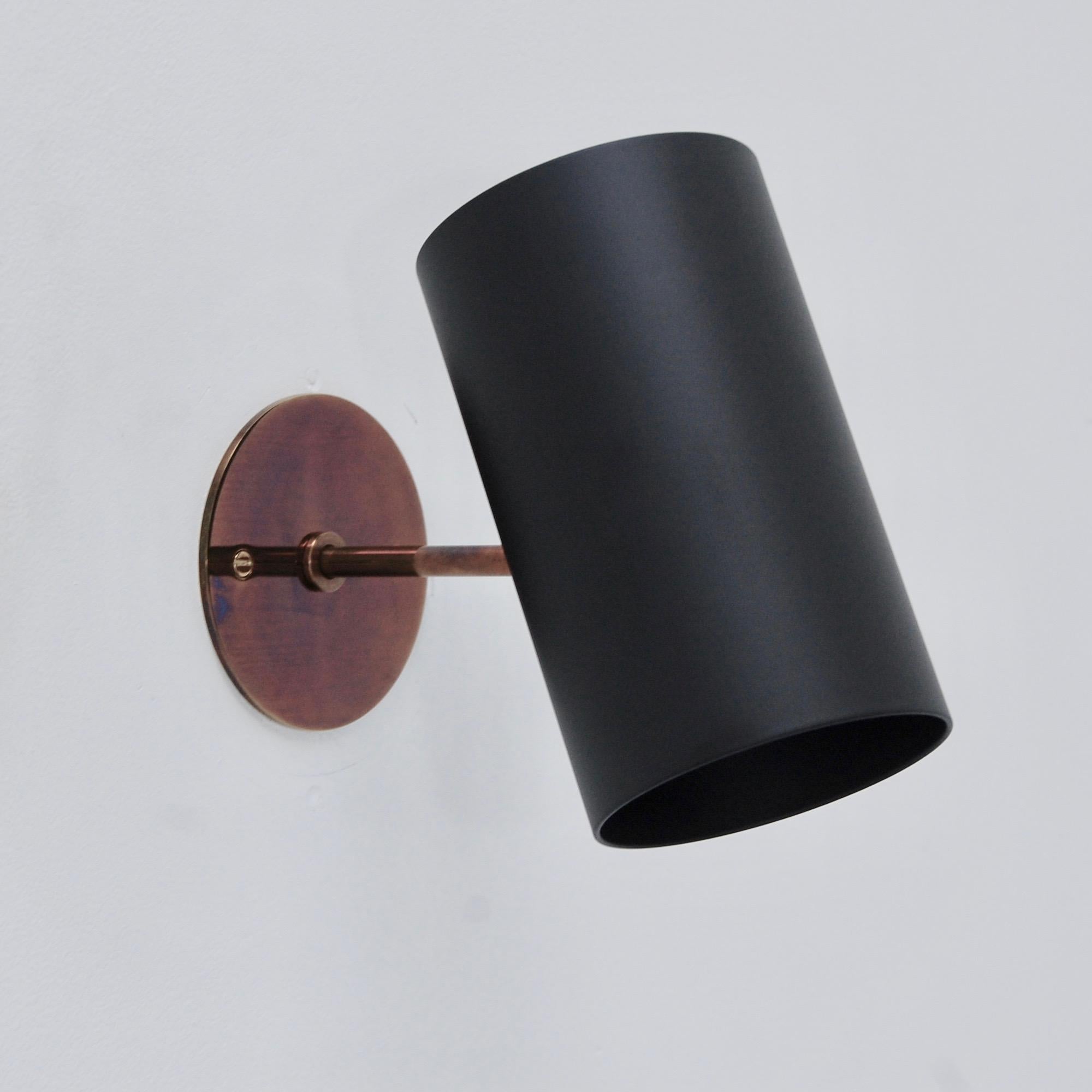 Part of our Lumfardo Luminaires contemporary collection, this black and brass LUbular sconce is a Directional reading sconce in a patina brass and painted aluminum finish. Single E26 medium based socket per sconce. Maximum wattage 75 watts per