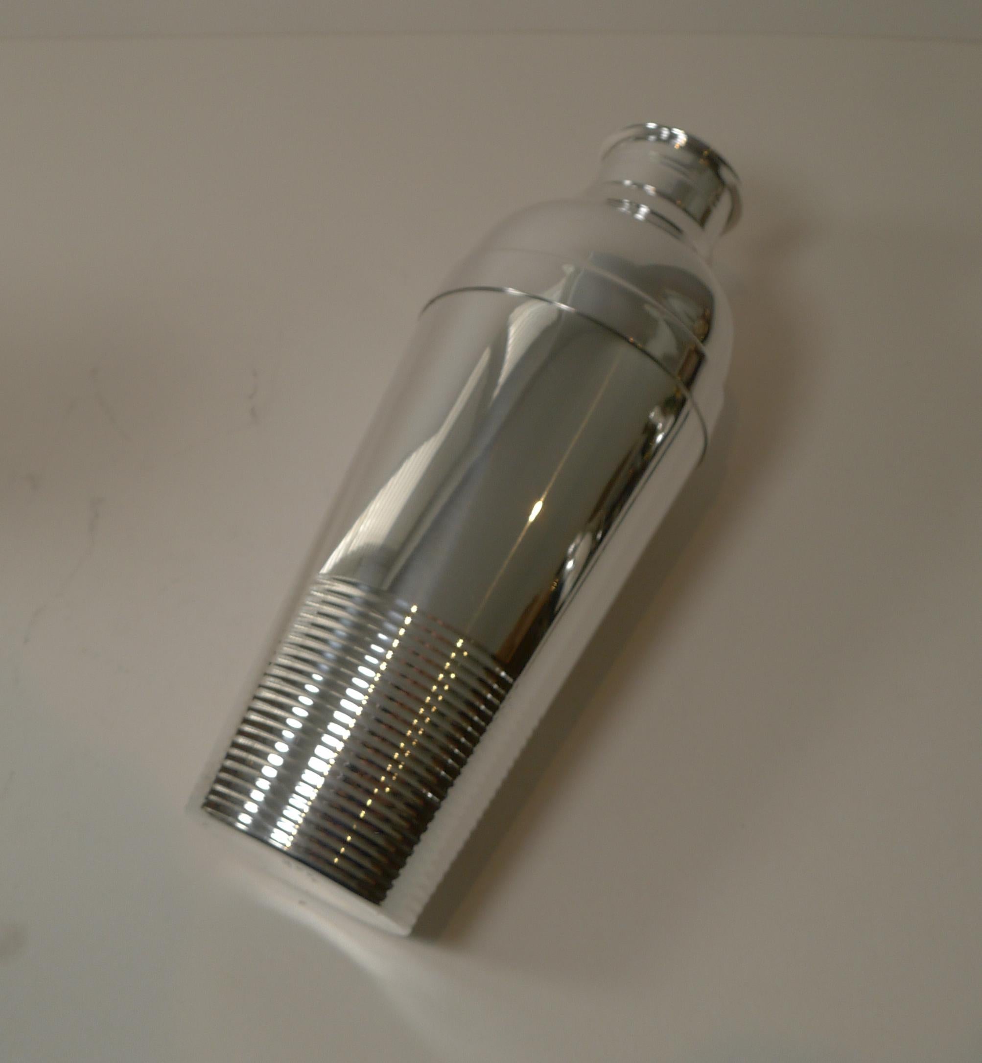 A handsome Art Deco silver plated cocktail shaker by top quality silversmith Christofle as part of their Gallia range in the Ondulations design.

This design was created for the luxury liner SS Normandie by the designer Luc Lanel. This grand Ocean