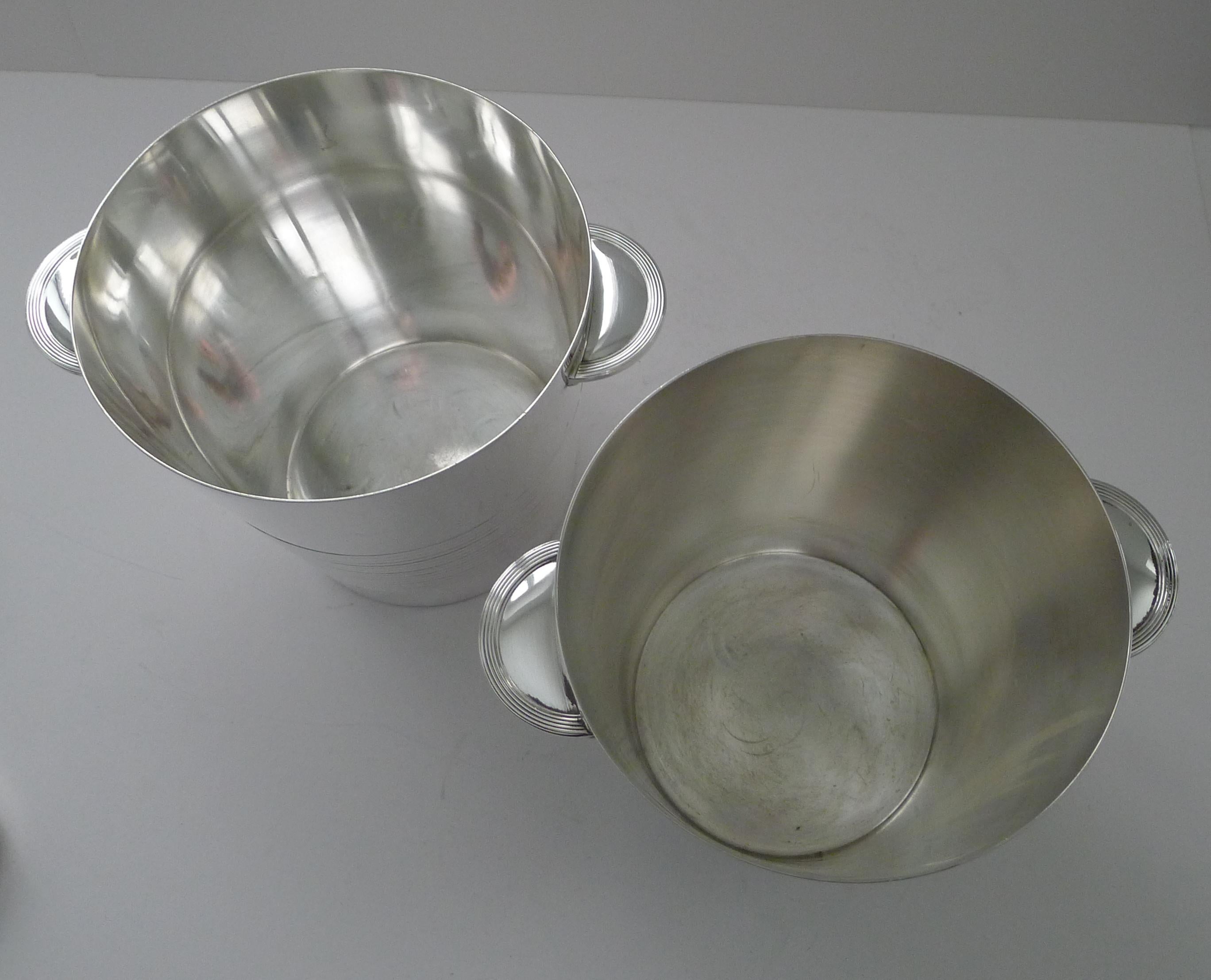 A rare opportunity to purchase a matching pair of iconic French Art Deco Champagne buckets / wine coolers.

These highly sought-after Champagne buckets were designed by Luc Lanel for Chrsitofle, Paris.

This 