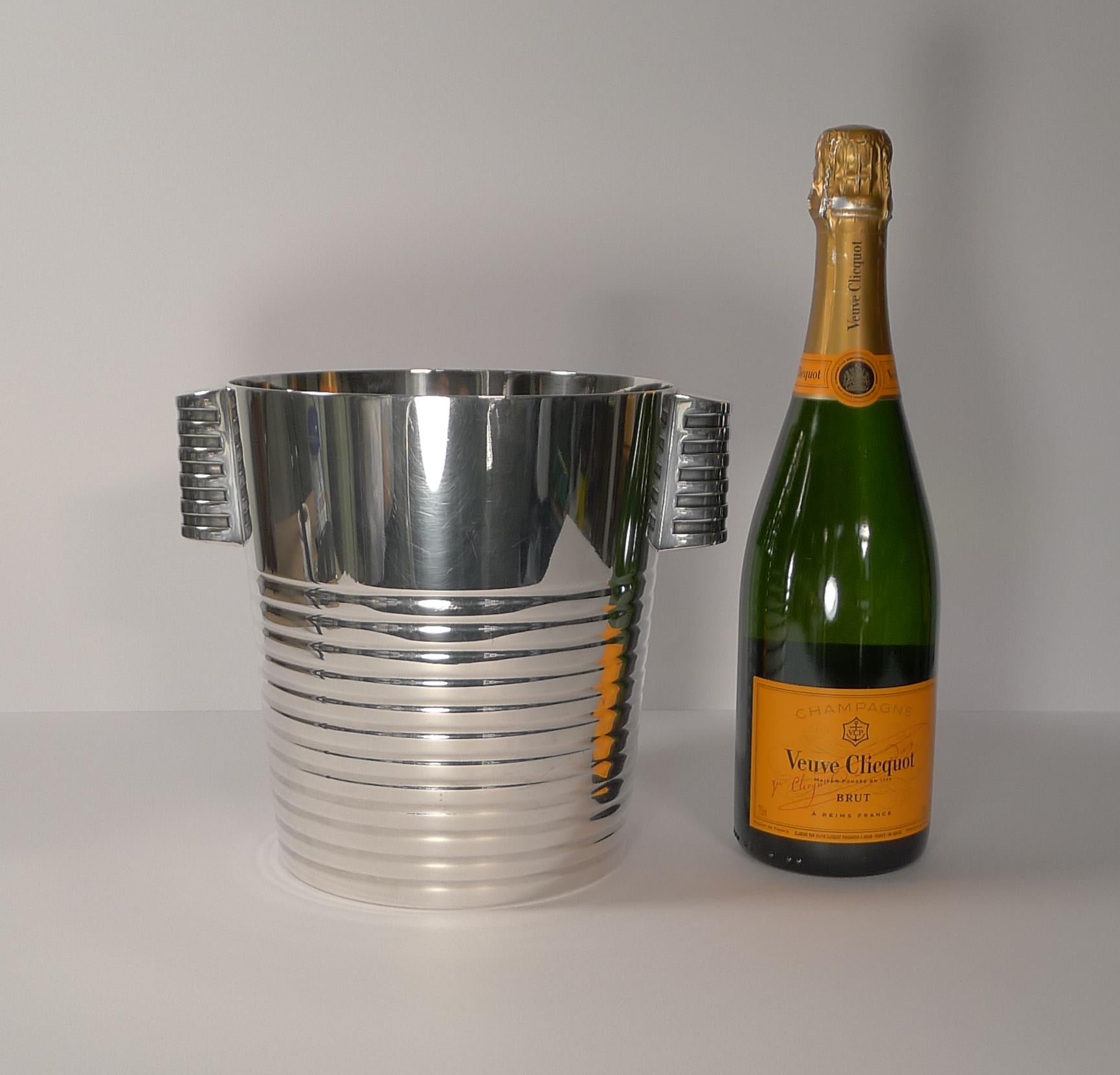 A fabulous Art Deco silver plated Champagne bucket designed by the celebrated Luc Lanel for Christofle designed in1932. A stylish ribbed vessel with with ribbed lug handles;

The pattern , called “Ondulations” was originally designed for the First
