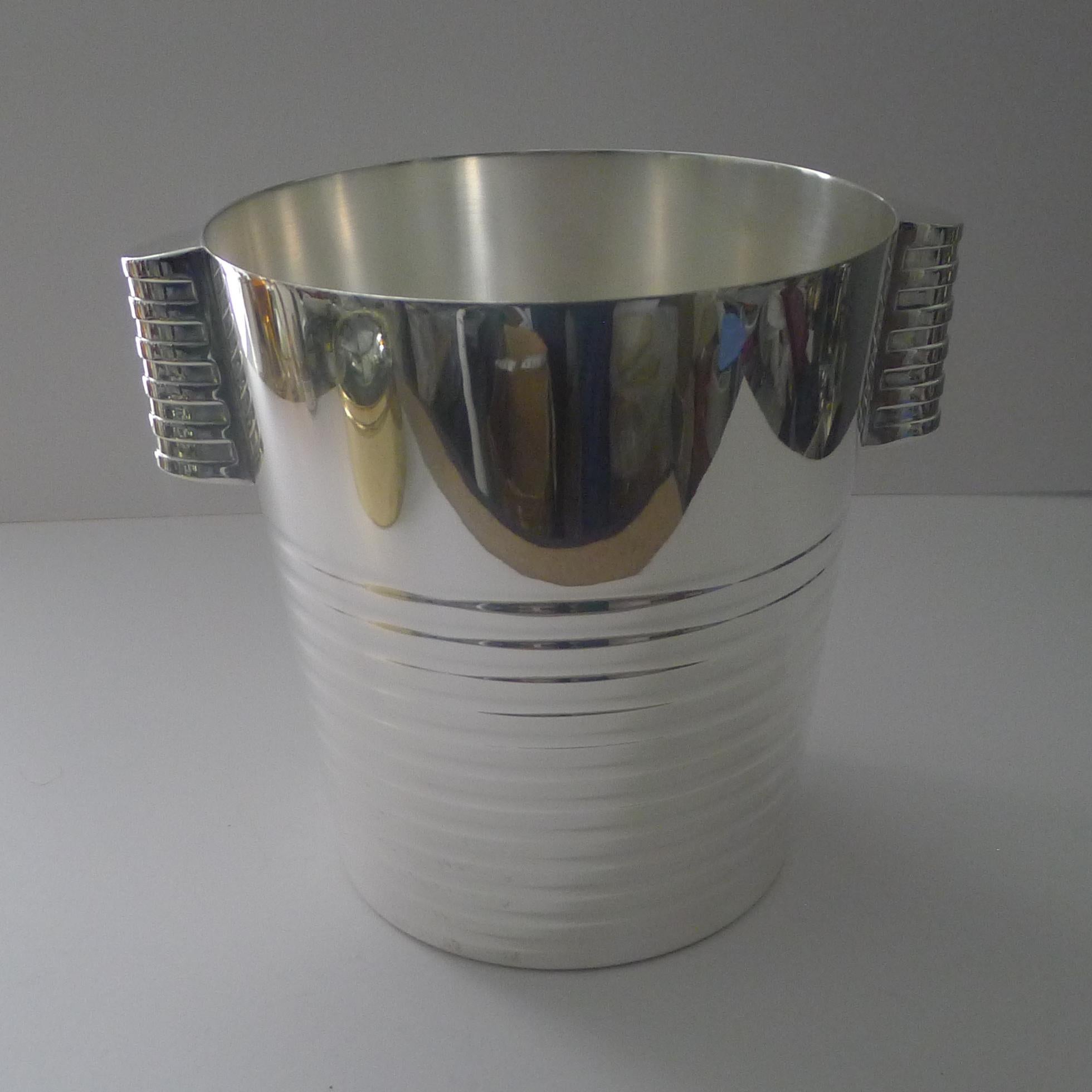 A fabulous Art Deco silver plated Champagne bucket designed by the celebrated Luc Lanel for Christofle designed in1932.  A stylish ribbed vessel with with ribbed lug handles;

The pattern , called “Ondulations” was originally designed for the  First