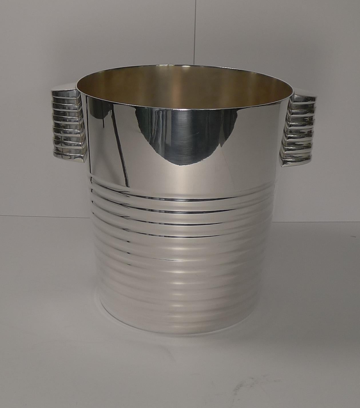 A fabulous Art Deco silver plated Champagne bucket designed by the celebrated Luc Lanel for Christofle, circa 1935.

The design is called 