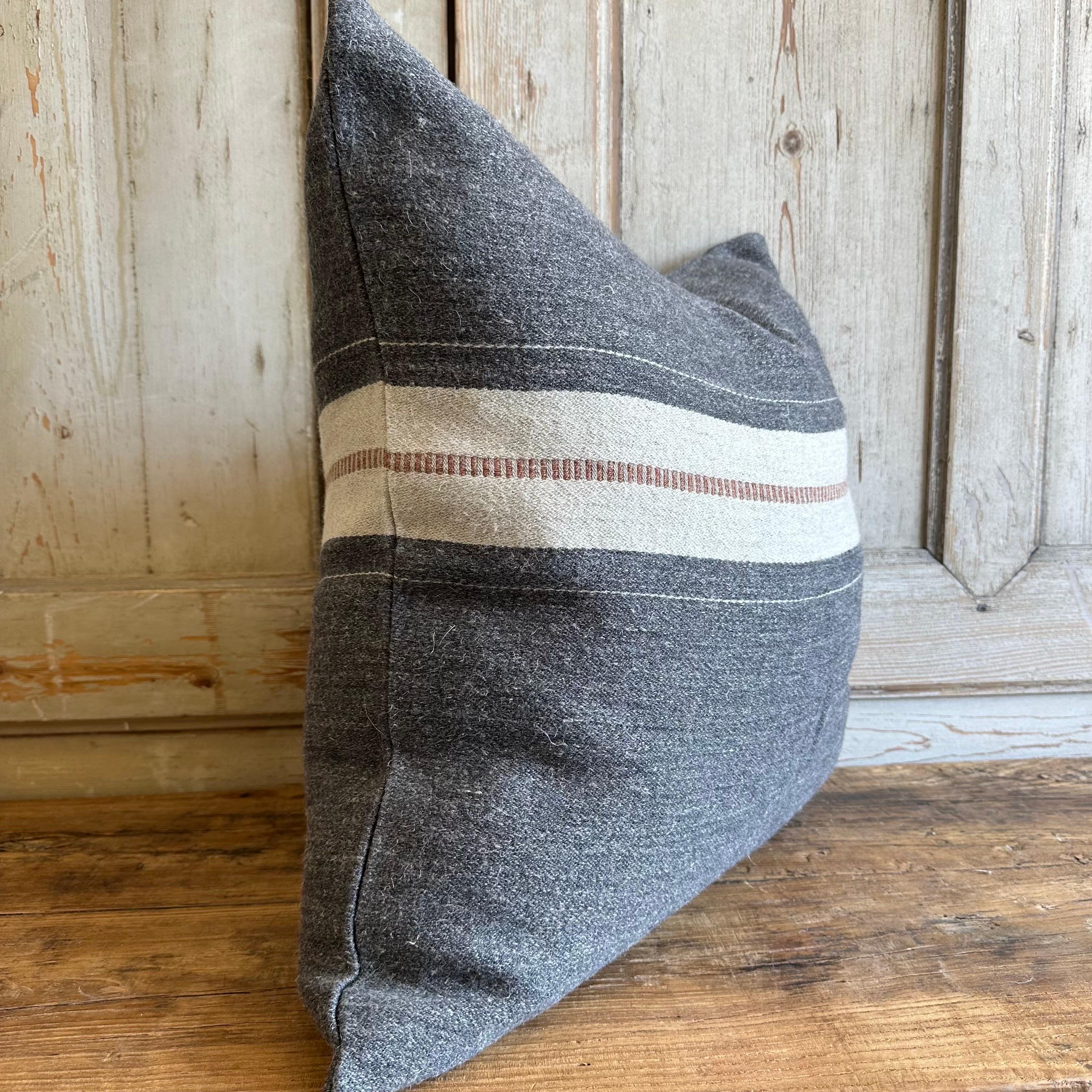 The Luc pillow in a warm gray ground finished with bone and copper stripes at each end. Zipper Closure.
Available in a throw as well.
70% linen - 30% wool.
Washed finish.
18 oz/yd² - 610 g/m132.
Dry Cleaning Recommended.
Down/Feather insert is