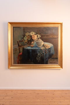 Nature morte à l'huile sur toile représentant une "table bleue" avec des fleurs