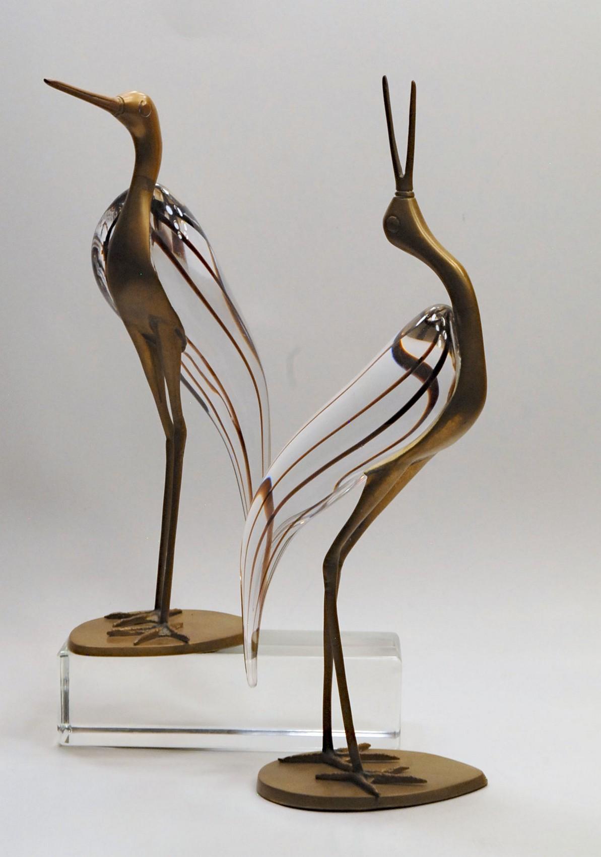 Beautiful rare and elegant pair of brass and glass herons (or egrets) from Luca Bojola.

These are from the 1980s when Luca Bojola started his designer career. At the time he was selling to Chapman Furniture and I was working for Sarreid Ltd.