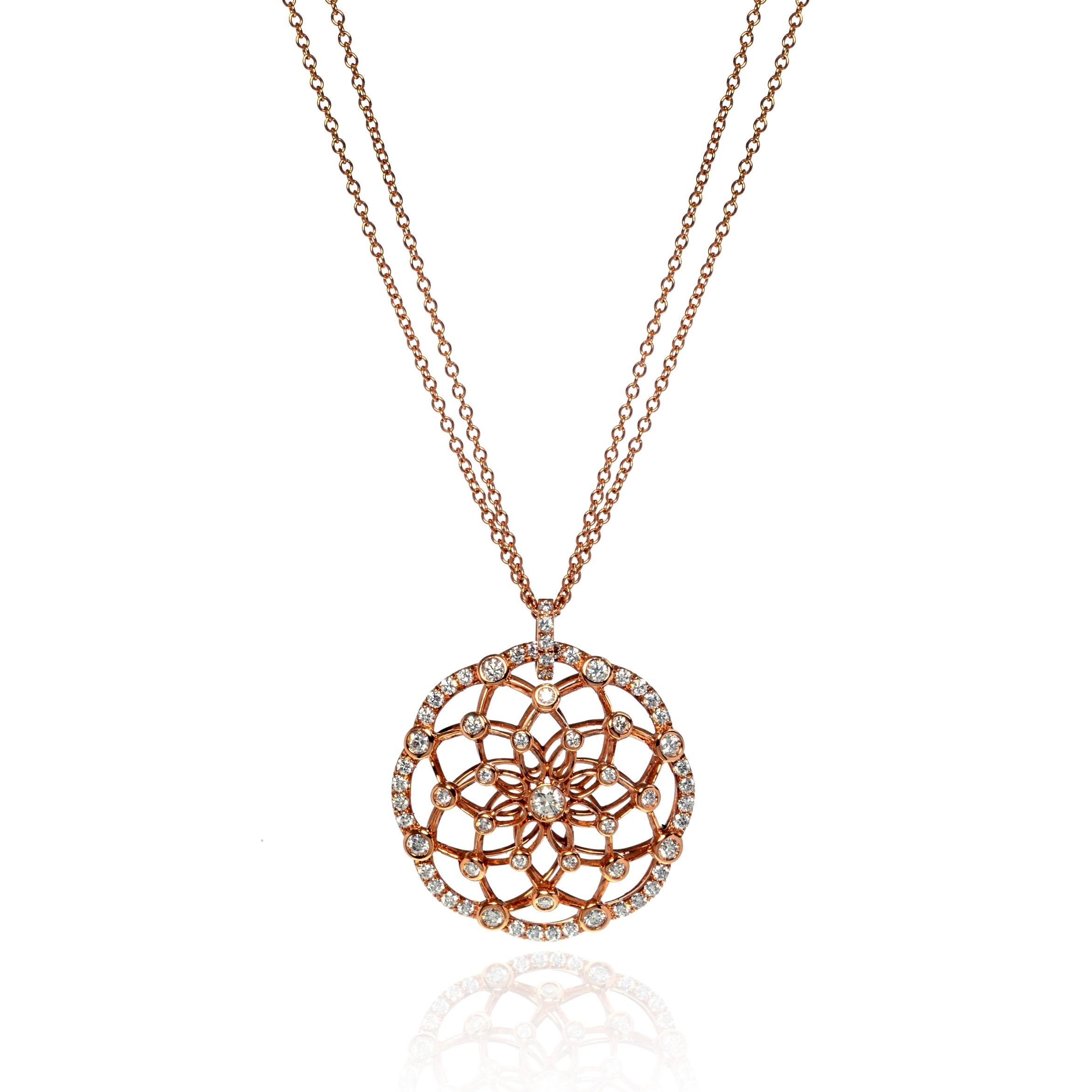 A stunning diamond circle shape pendant with a floral design inside. This necklaces showcases 1.66cttw brilliant-cut diamonds beautifully accenting the pendant. The diamonds are very bright and are of G color and VVS -VS clarity. Pendant size: 1.25