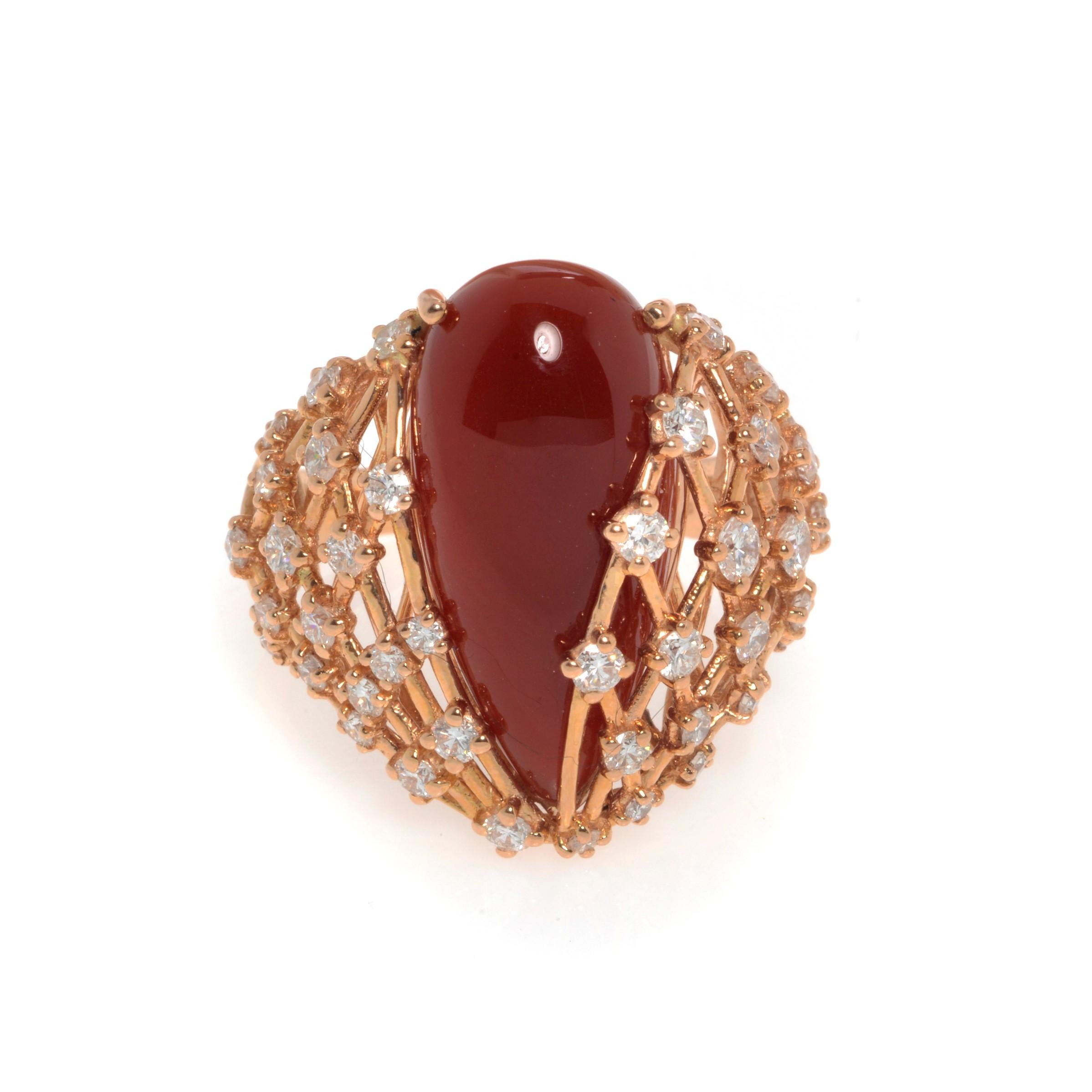 This beautiful cocktail ring features a large natural pear shape red Agate gemstone in 18k rose gold setting. Set with 1.22cttw of brilliant cut diamonds. Diamond color G and VVS clarity. Red Agate weights 1.80 grams. Ring size 7.75. Top