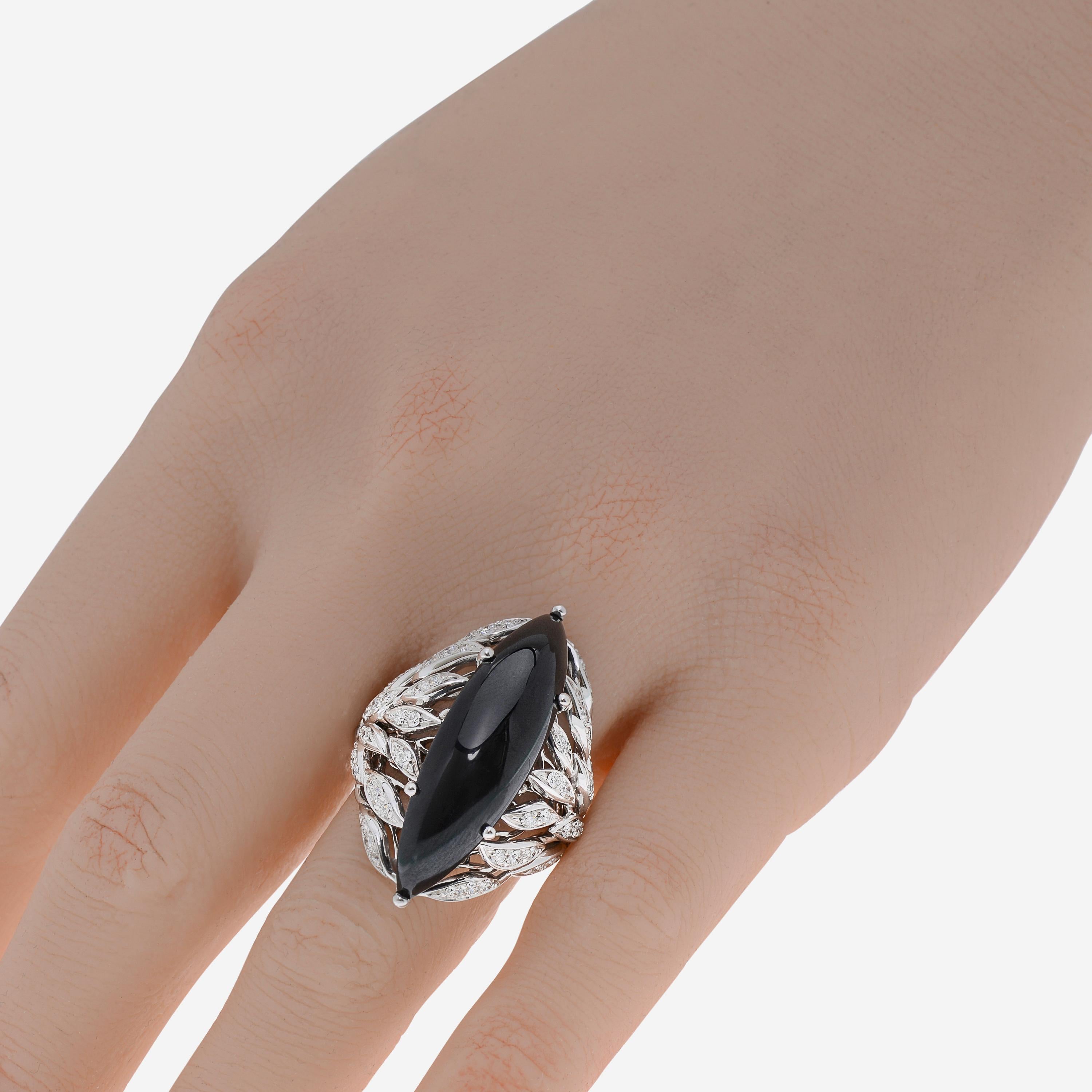This adventurous Luca Carati 18K White Gold Cocktail Ring features glittering 0.78ct. tw. accent diamonds adorning a center of Onyx. The ring size is 6.75 (53.8). The Band Width is 3.5mm. The Weight is 13.4g.
