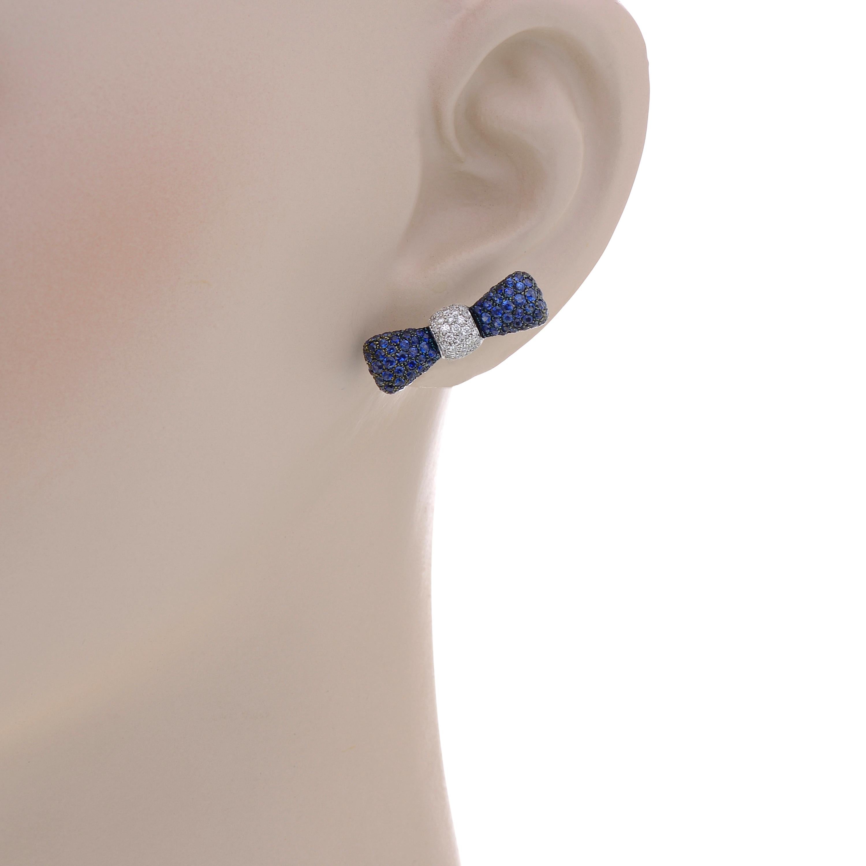 These beautiful Luca Carati 18K White Gold Stud Earrings feature a glittering bow crafted from 0.34ct. tw. diamonds and 1.85ct. tw. Sapphire. The Decoration Size is 23.5mm x 6.5mm. The Weight is 9.2g.
