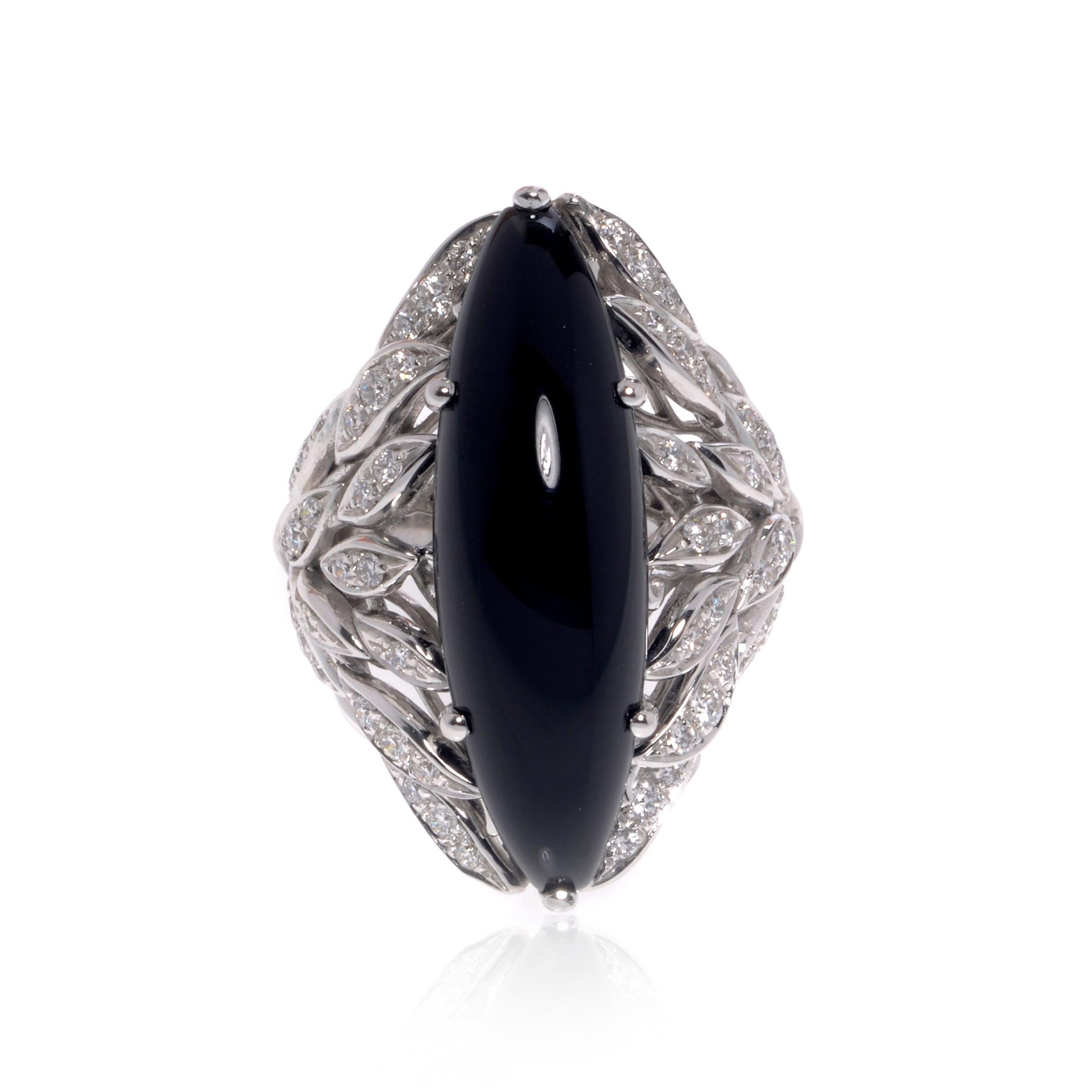 This beautiful cocktail ring features a large natural marquise shape Black Onyx in 18k white gold. Set with 0.79cttw of brilliant cut diamonds. Diamond color G and VVS clarity. Onyx weights 2.40 grams. Ring size 6.5. Top measurements: 32.00mm. Comes
