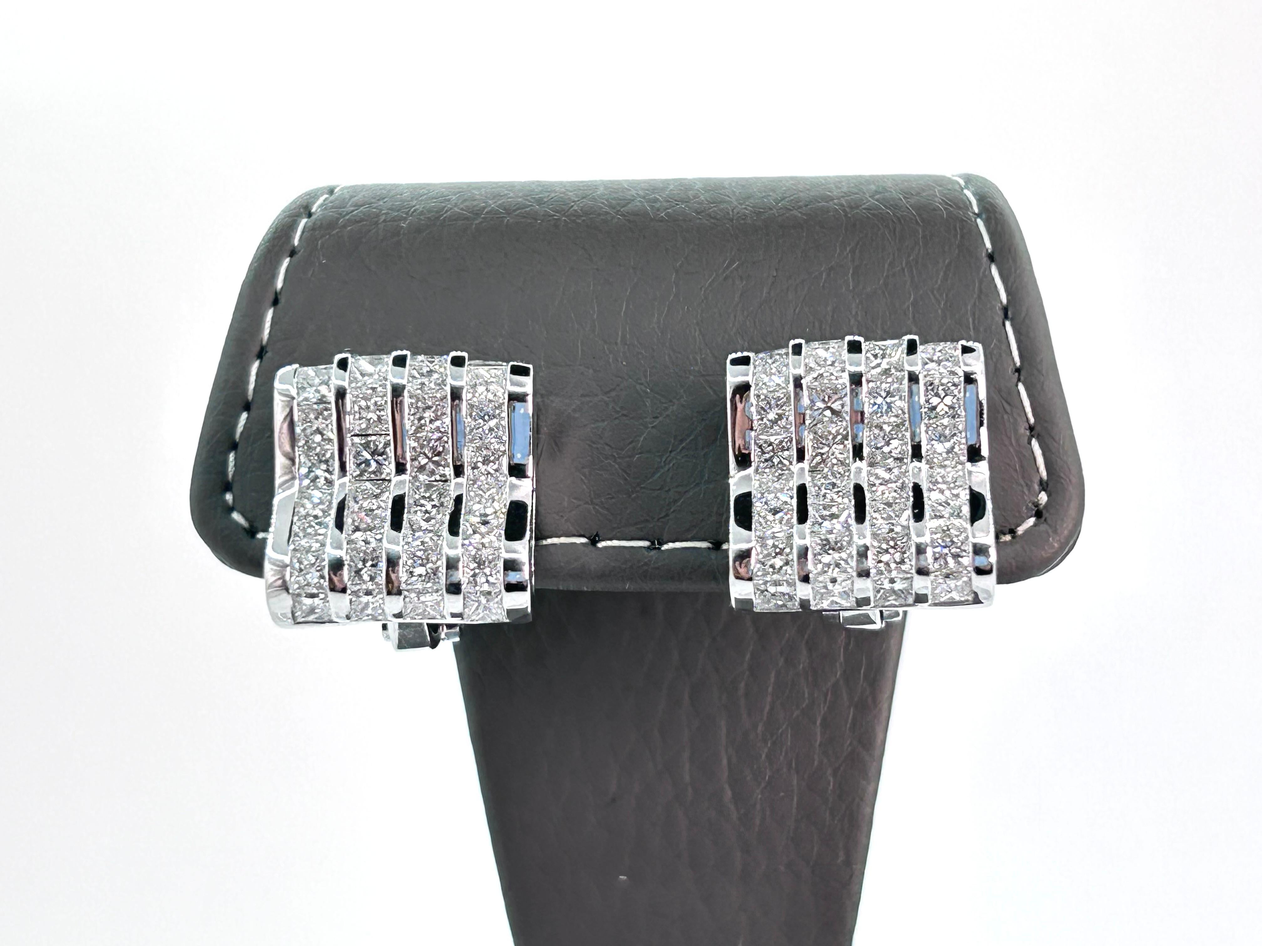 Beautiful Diamond Earrings made by Luca Carati, Italy.
Superb Quality Throughout!
7.00 Carat Total Weight of Princess Cut Diamonds set in 18 Karat White Gold.
Average Diamond Clarity is VS1 and average Color is G.
A wavy design on the Earrings bring