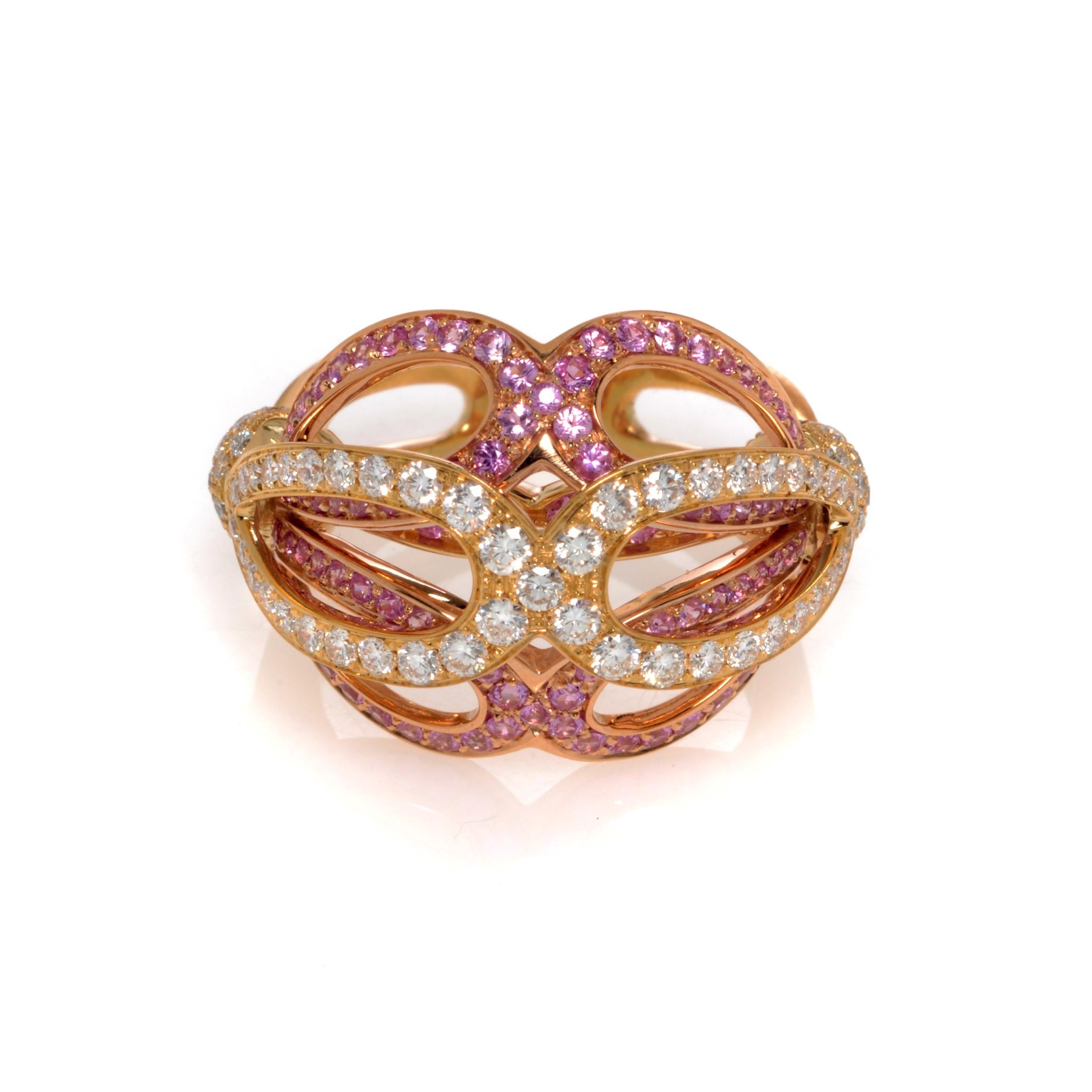 Beautiful Diamond and Pink Sapphire Cluster Cocktail Ring crafted in 18k Yellow Gold. This ring is pave set with 1.06cttw of brilliant cut diamonds. Diamond color G and VVS clarity. Also set with round cut natural pink Sapphires, totaling 1.26cttw.