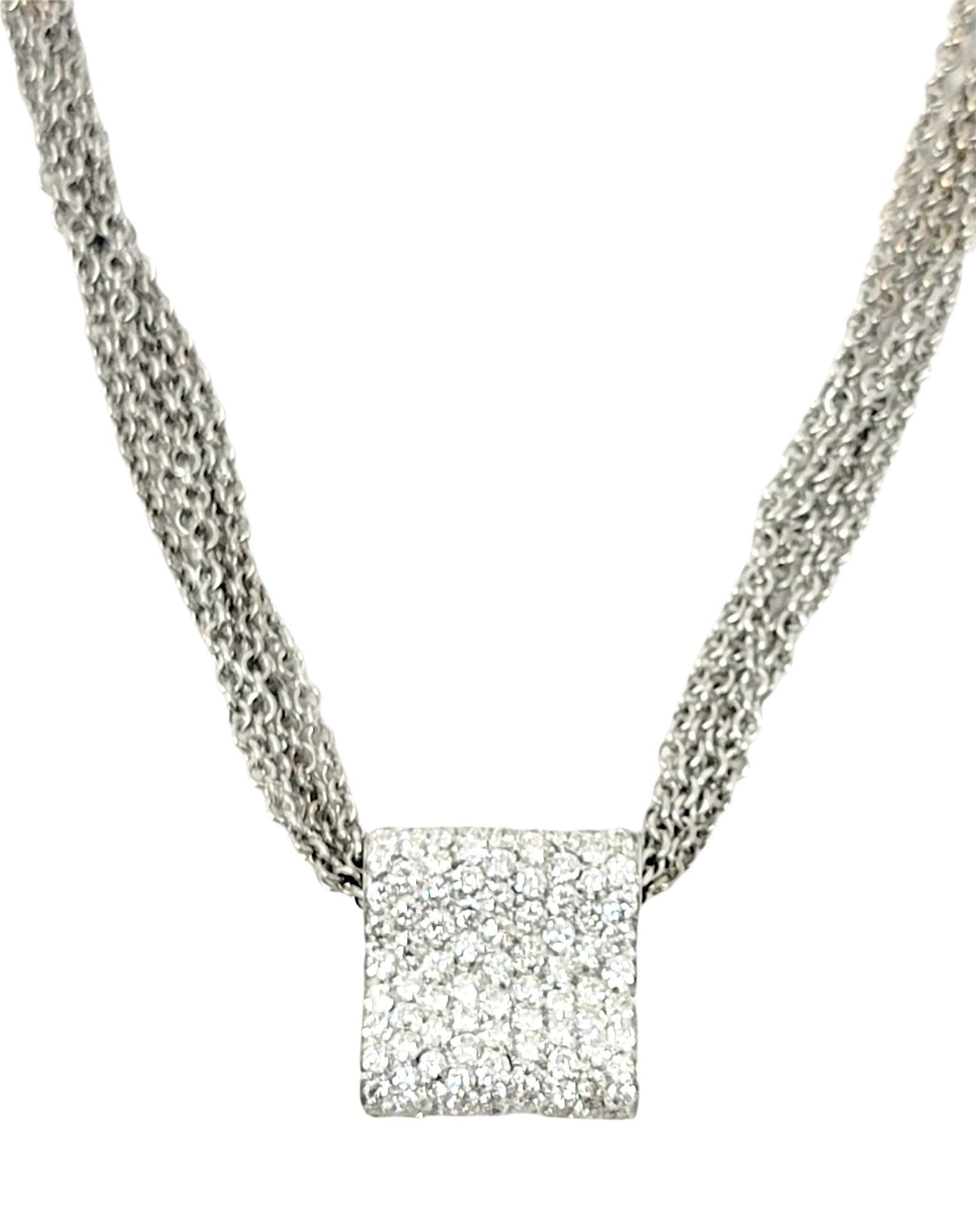 Absolutely stunning pave diamond pendant necklace by jewelry designer, Luca Carati. The contemporary contoured shape of the pendant makes the natural diamonds really shimmer beautifully in the light, while the delicateness of the 5 strand chains