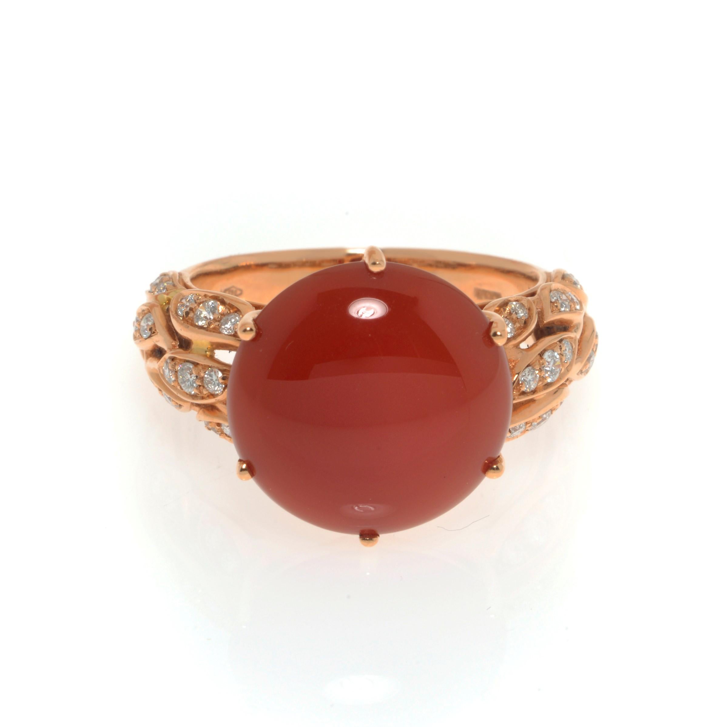 A cabochon center red Agate ring with pave set diamonds. Crafted in 18K rose gold. Total carat weight 0.34. Diamond color G and VVS clarity. Ring size 7.75. Comes with original box and a certificate.
