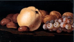 XVII secolo di Luca Forte Noci, castagne, un grappolo d'uva e una mela cotogna