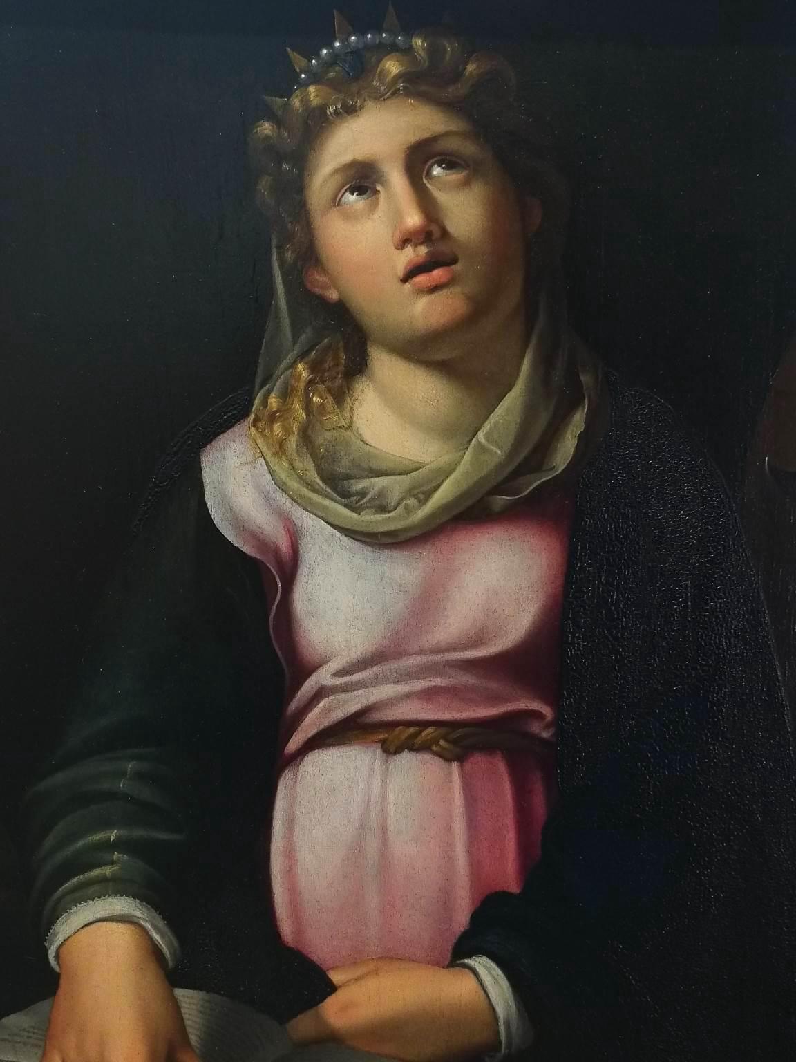 Le tableau, dont le sujet est Sainte Catherine d'Artistics avec la roue brisante utilisée pour son martyre, peut être attribué à l'artiste maniériste de la région d'Émilie-Romagne Luca Longhi grâce à diverses similitudes avec ses œuvres. 
Par
