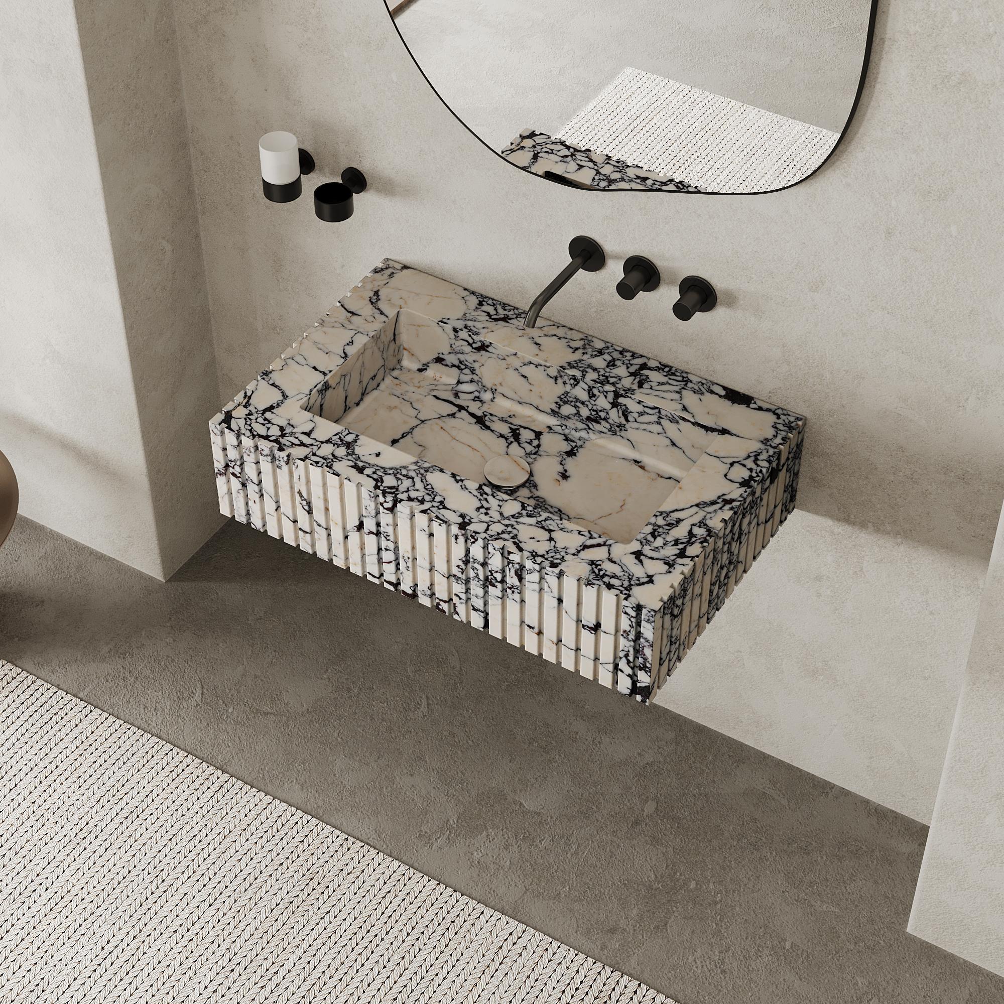 Accentuez l'espace de votre salle de bains avec notre vasque en marbre strié, une fusion parfaite entre le design minimaliste et l'élégance naturelle. Les magnifiques détails nervurés créent un attrait visuel unique tout en mettant en valeur les