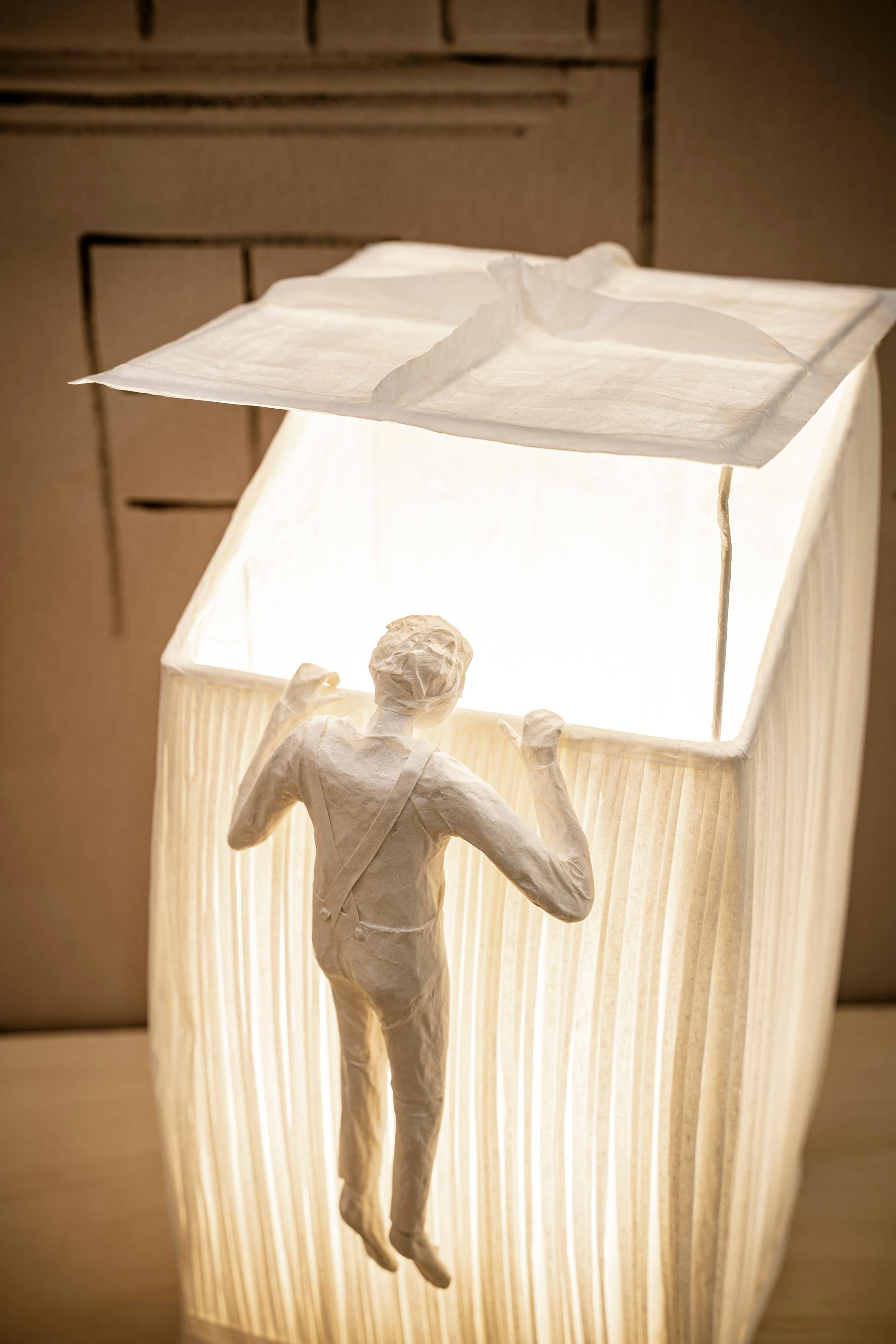Lucarne Paper Light Sculpture, One Character, by Papier à êtres
One of a Kind
Dimensions: D 22 x W 22 x H 42 cm.
Materials: Paper.

Sophie Mouton-Perrat and Frédéric Guibrunet have been working with paper for almost twenty years, each in their own
