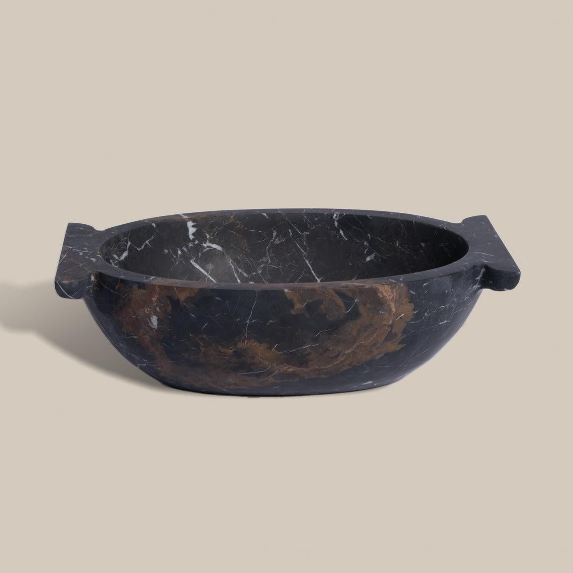 Designed in collaboration with Atrio, this large marble dough bowl is exclusive to Montana Labelle Lifestyle. Versatile as a centerpiece, catchall or coffee table statement, we love the one-of-a-kind subtleties of the natural marble.

Atrio is a new