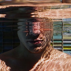 Mind Over Matter (Young male diver tests breath control in sun splashed  pool)