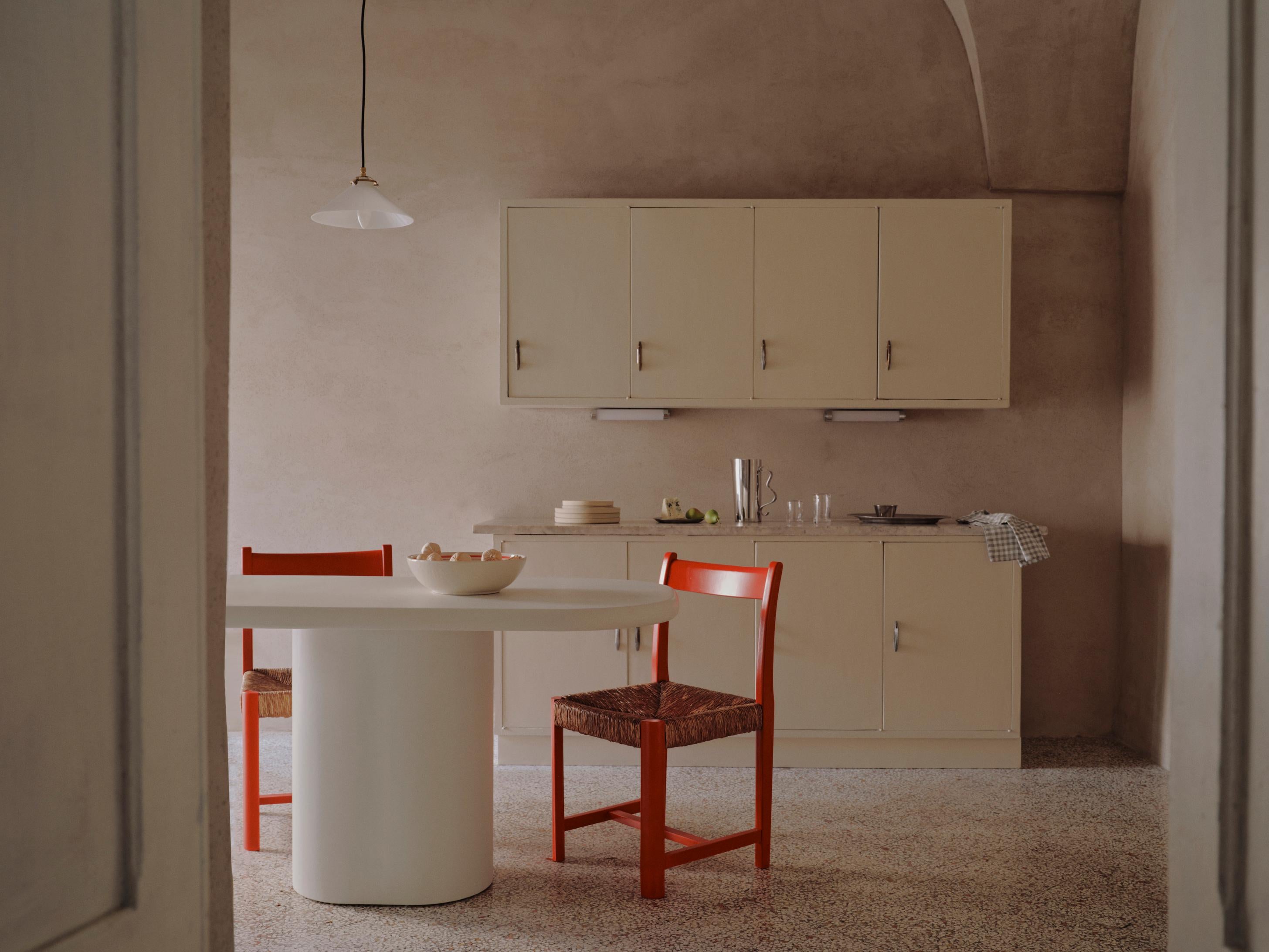 Handcrafted in Spain by expert artisans, this oval-shaped dining table from Marlot Baus combines timeless design with modern craftsmanship. Each piece is carefully made using our signature microcement technique, layered by hand to achieve a smooth,