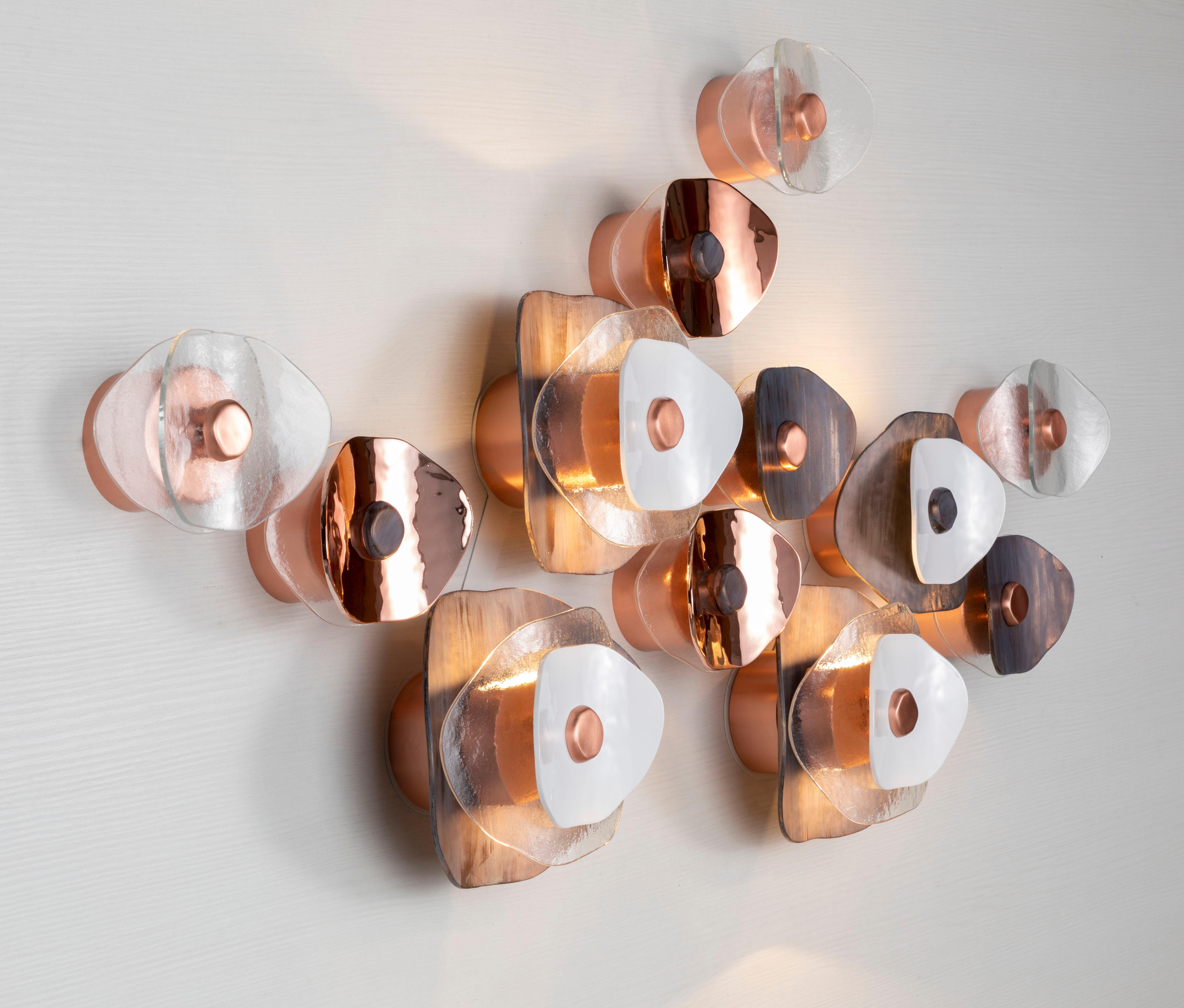 Horizontal wall composition of twelve flower elements (four with light, eight decorative). Transparent glass petals, polished rose gold, polished white and antiqued copper finish; brushed rose gold metal hardware. 

No.4 flower-elements with LED