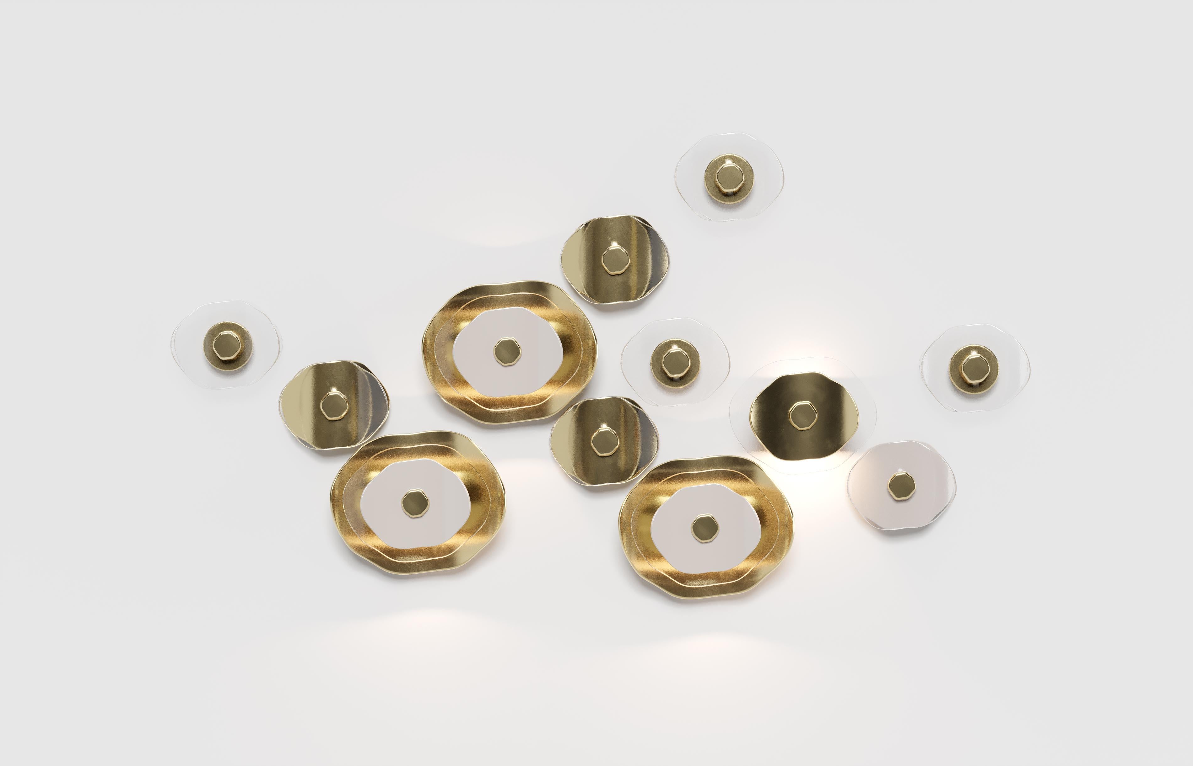 Horizontal wall composition of twelve flower elements (four with light, eight decorative). Petals in clear glass, polished light gold and polished white finish; metal hardware in polished light gold. 

No.4 flower-elements with LED module for upper