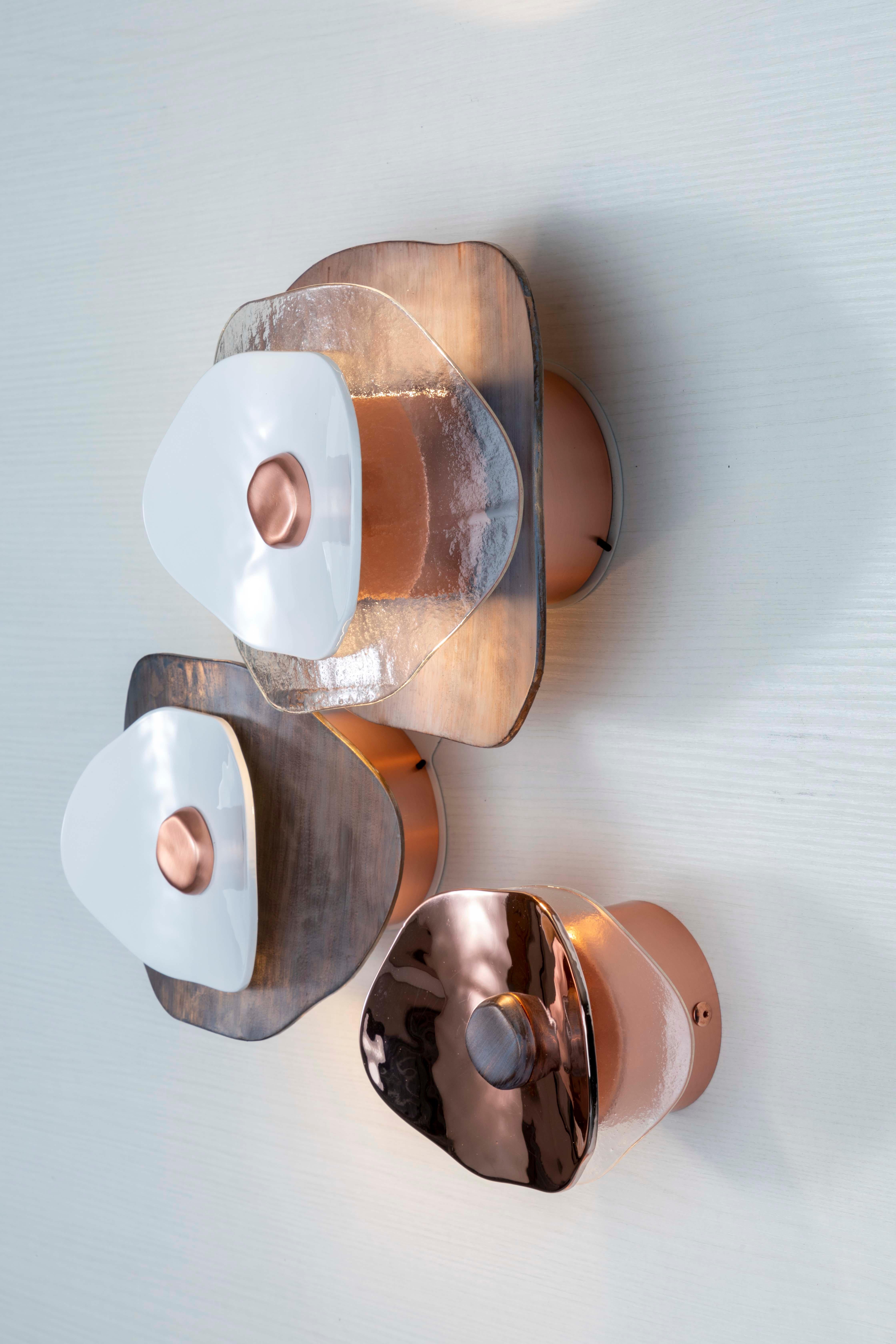 Wall composition of three flower elements (two with light, one decorative). Transparent glass petals, polished rose gold, polished white and antiqued copper finish; brushed rose gold metal hardware. 

No. 2 flower-elements with LED module for upper