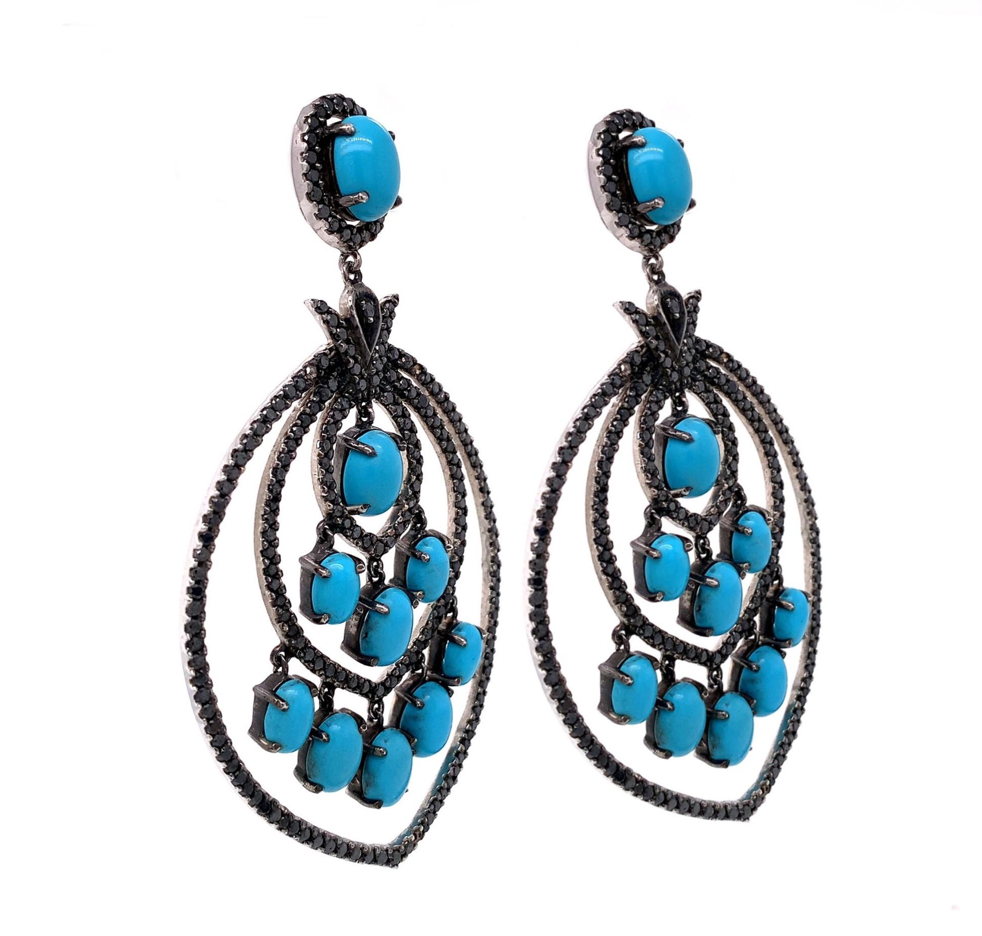 Life in color Collection

Strong expression of blue Turquoise accented by black Diamonds chandelier style Statement earrings set in blackened Sterling Silver.

Turquoise: 19.36ct total weight.
Diamond: 6.28ct total weight.