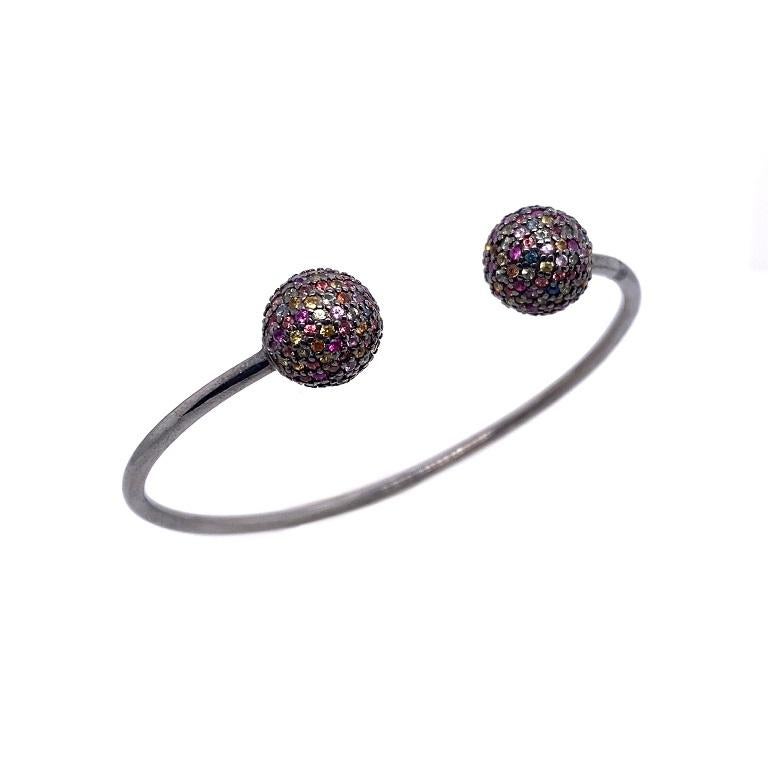 Life in Color Collection 

Multi color Sapphire pave ball open bangle bracelet set in blackened sterling silver. Bracelet measures at approximately 2.5x2 inches.



