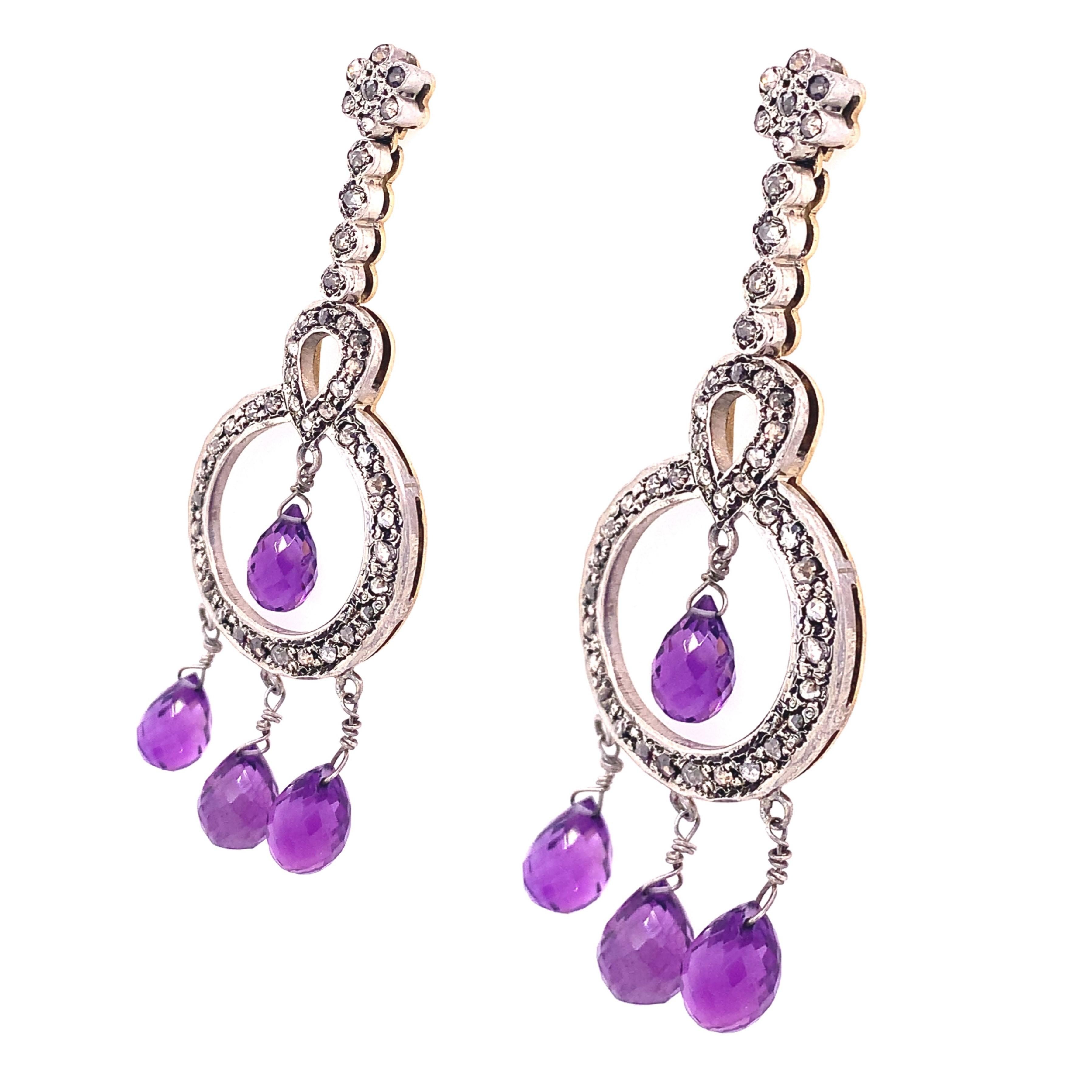Life in color Collection

This Victorian style silver earrings made of diamonds and Amethyst crystal balls drop moving freely. Set in Sterling Silver and 18K yellow gold.

Amethyst : 6x9 mm , 8x10 mm approximately.