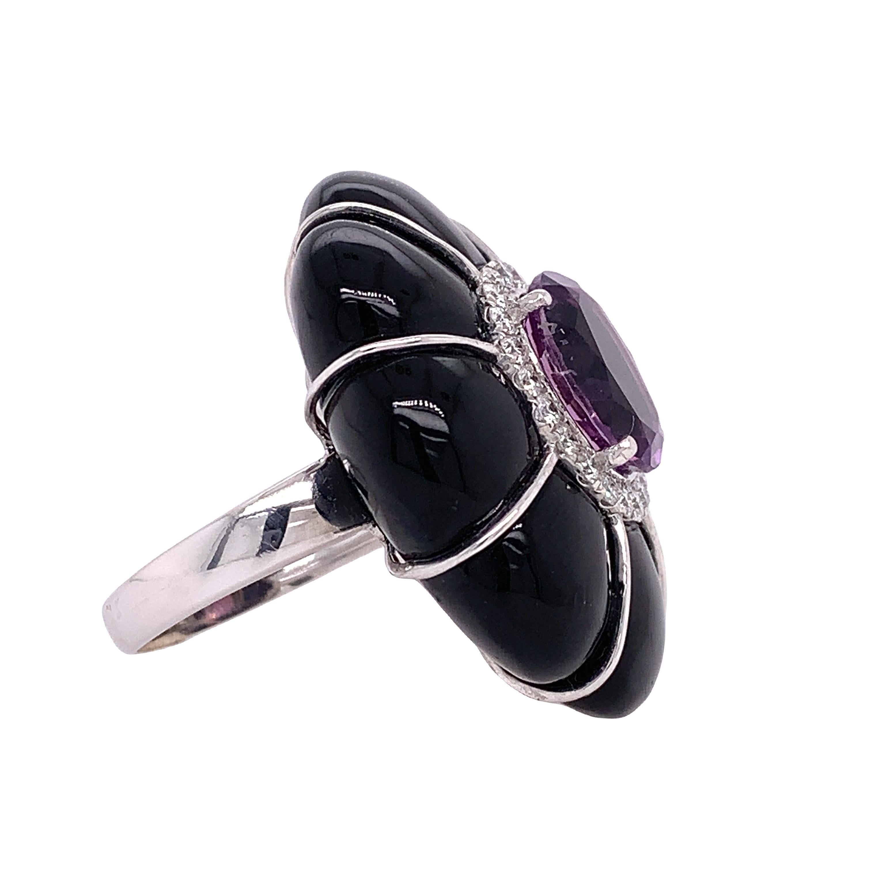 Palm beach Collection

This beautiful and alluring cocktail ring features an oval Amethyst, Black Onyx and white diamonds to complete the look. The ring is set in 18K white gold and makes for a great gift for your loved one.

Amethyst: 2.80ct total